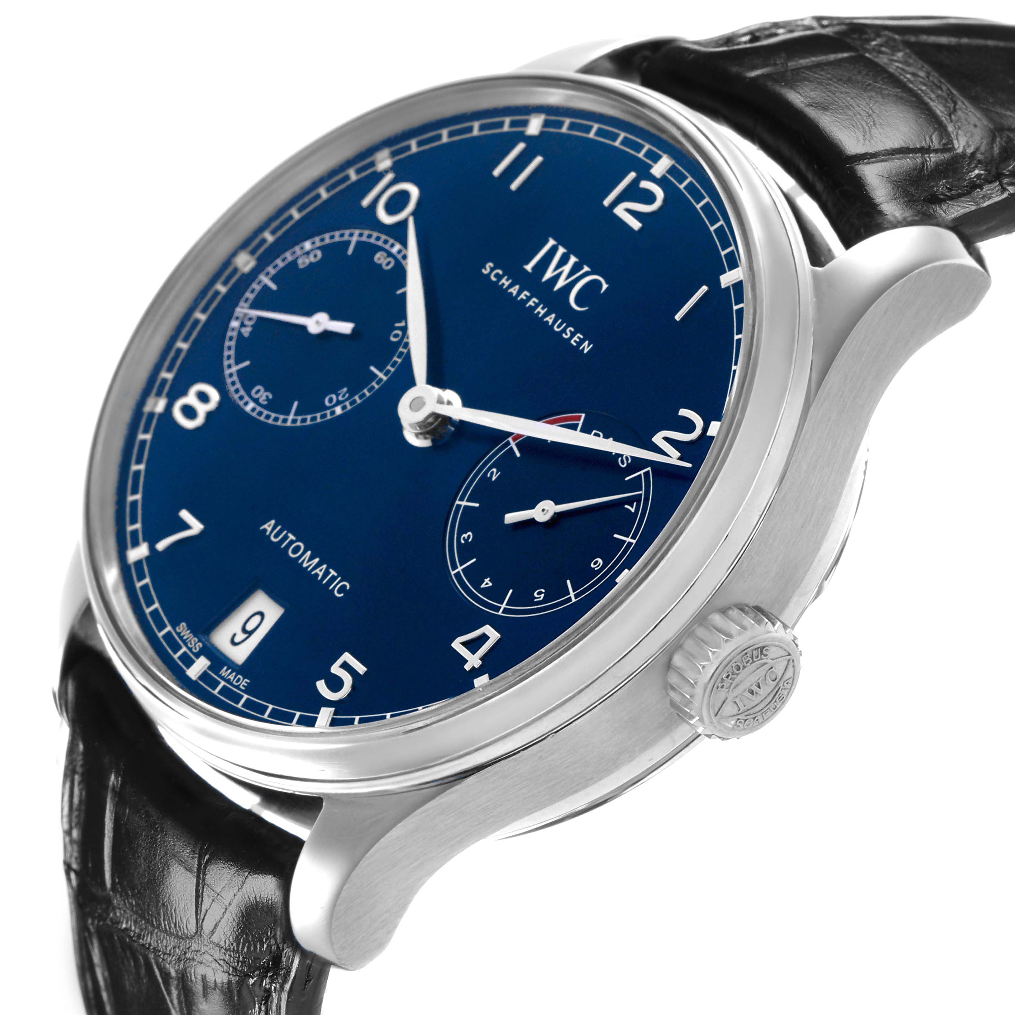The IWC Portuguese IW500710 Men's Stainless Steel Blue Dial watch is shown from a side angle, displaying its blue dial, two subdials, crown, and leather strap.
