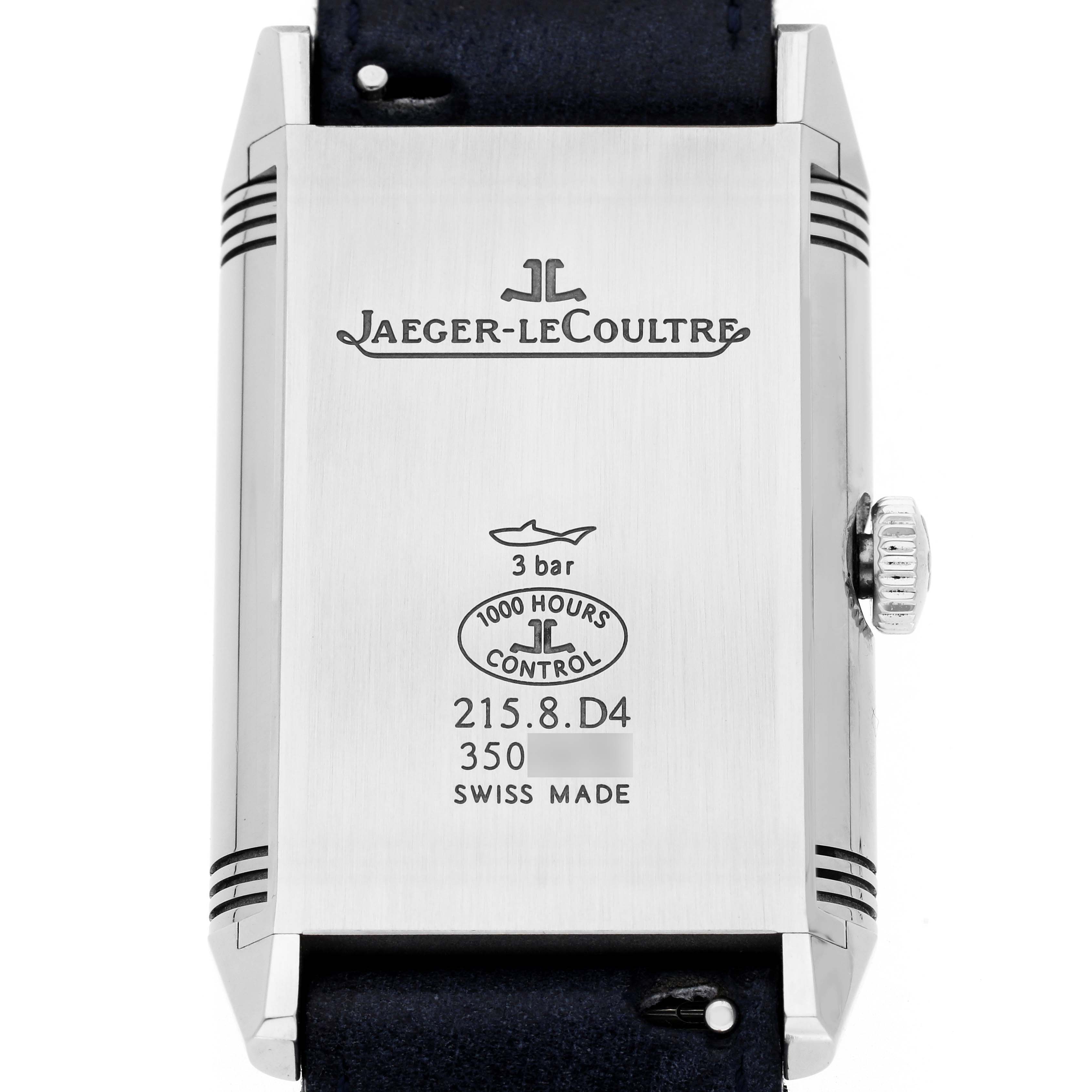 The image shows the back of the Jaeger-LeCoultre Reverso watch, highlighting engravings and the crown on the side.