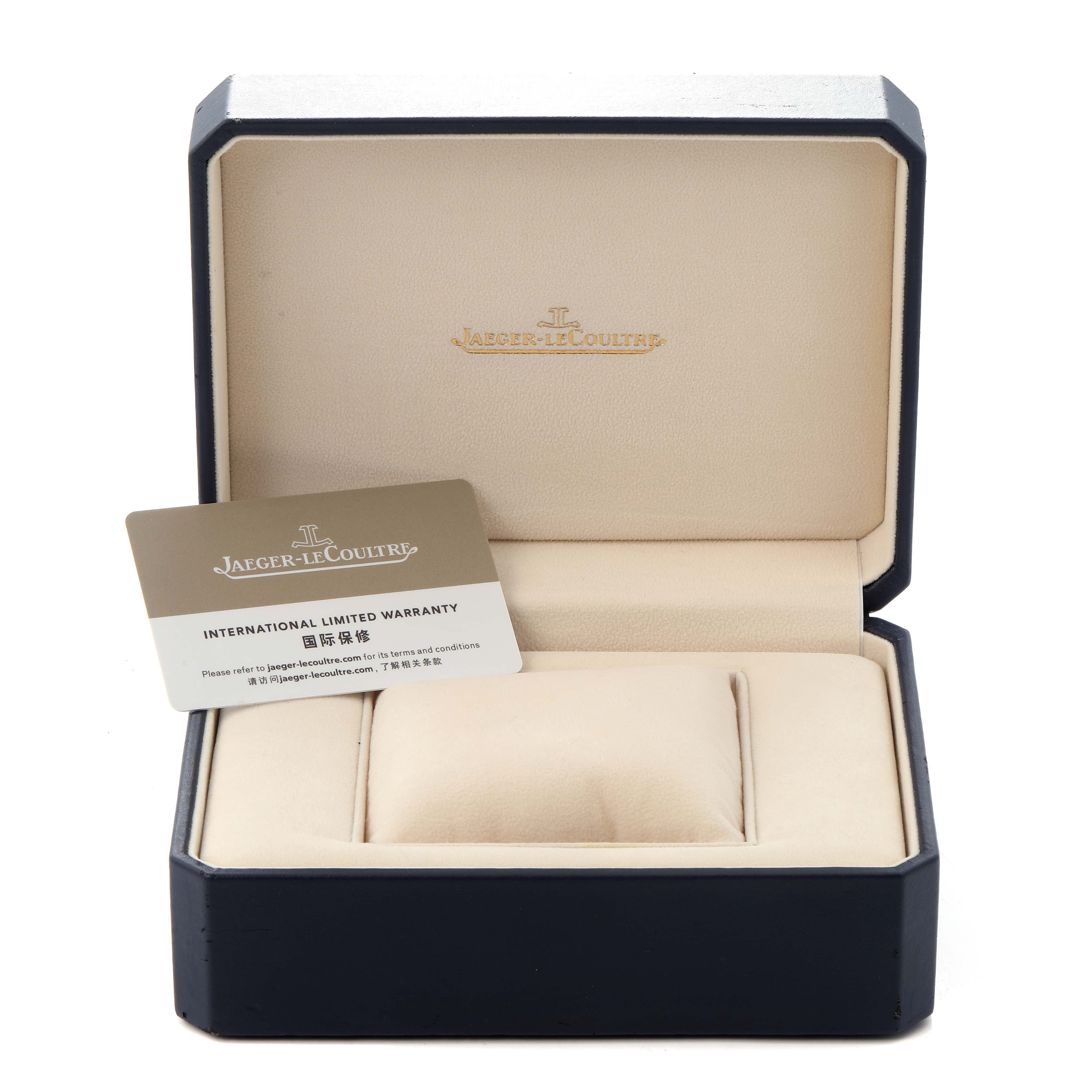 The image shows a Jaeger-LeCoultre Reverso watch
s open box with an international warranty card inside.