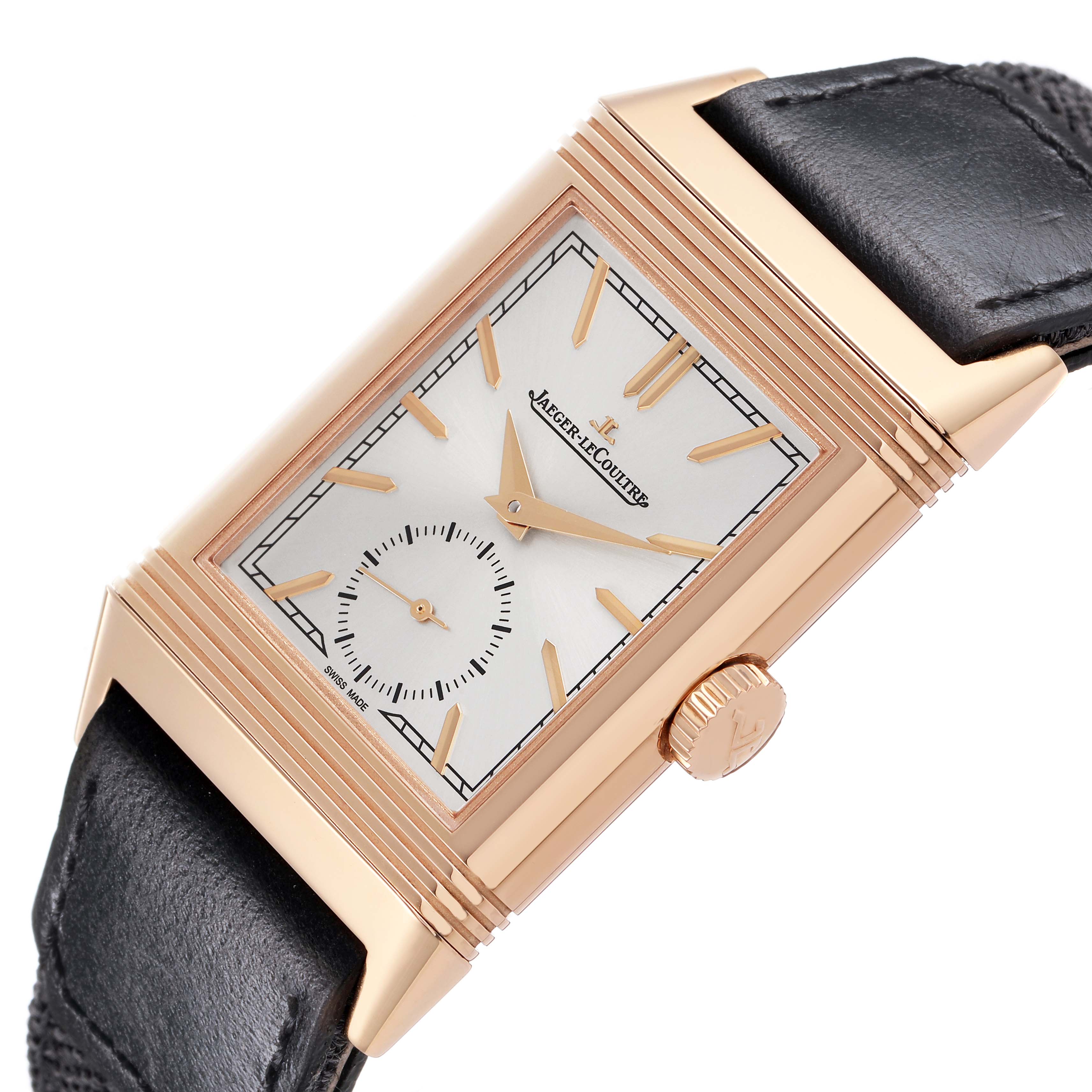The Jaeger-LeCoultre Reverso watch is shown at a slight angle displaying its rectangular face, crown, and part of the leather strap.