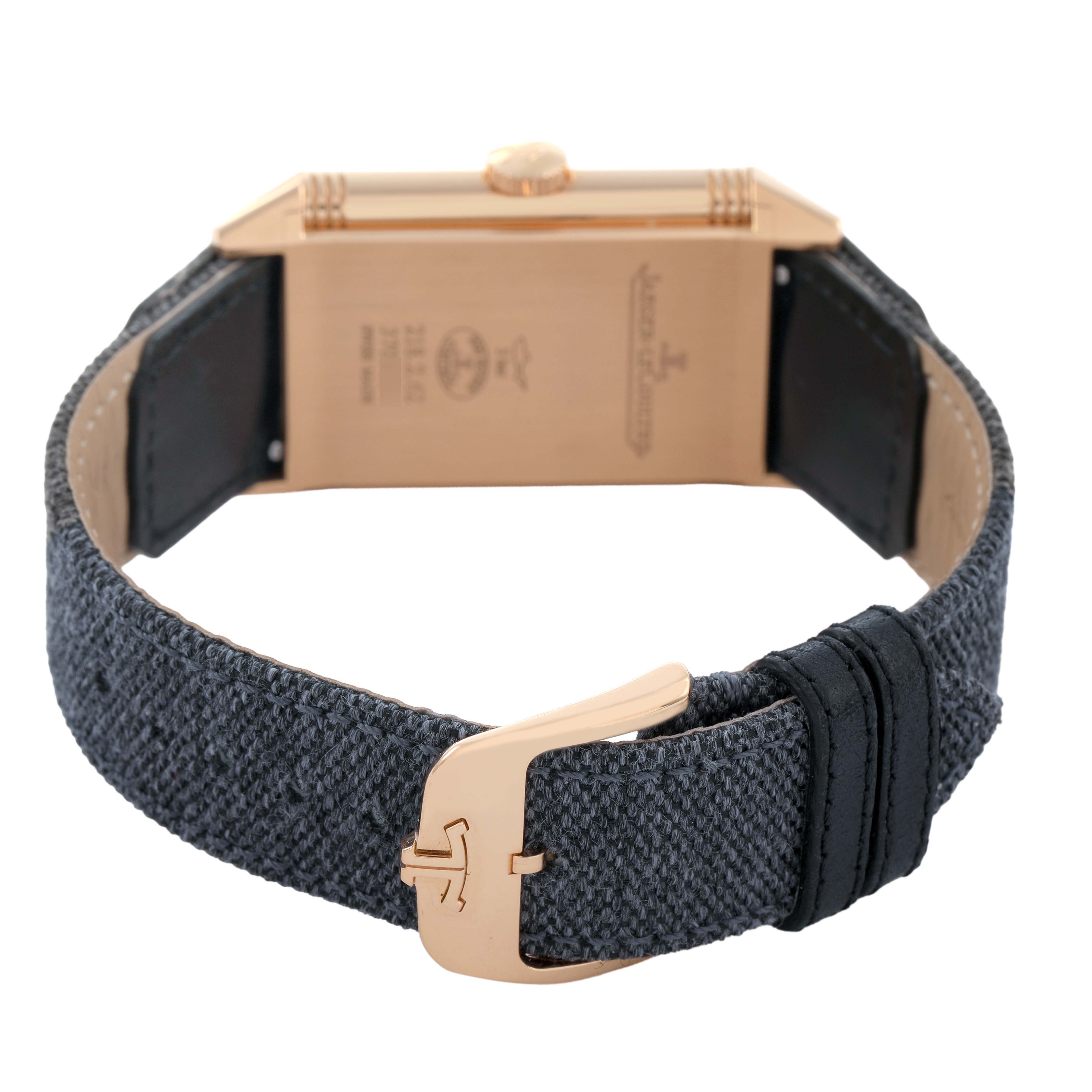 The Jaeger LeCoultre Reverso Q7132521 Men's Rose Gold Silver Dial watch is shown from the back, highlighting the buckle, strap, and case rear with branding.