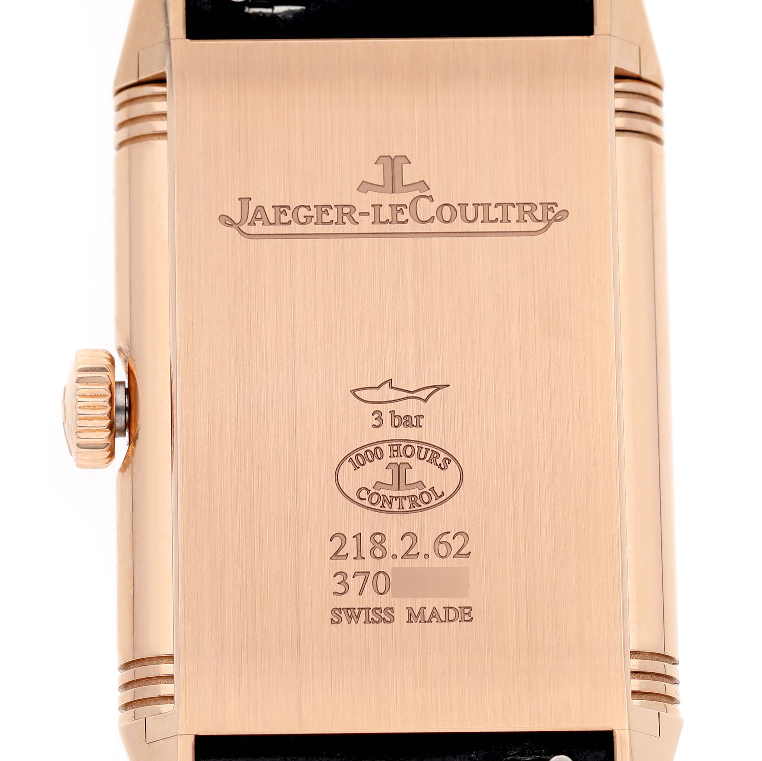 The image shows the back case of the Jaeger-LeCoultre Reverso watch, highlighting its engravings and crown from a side angle.