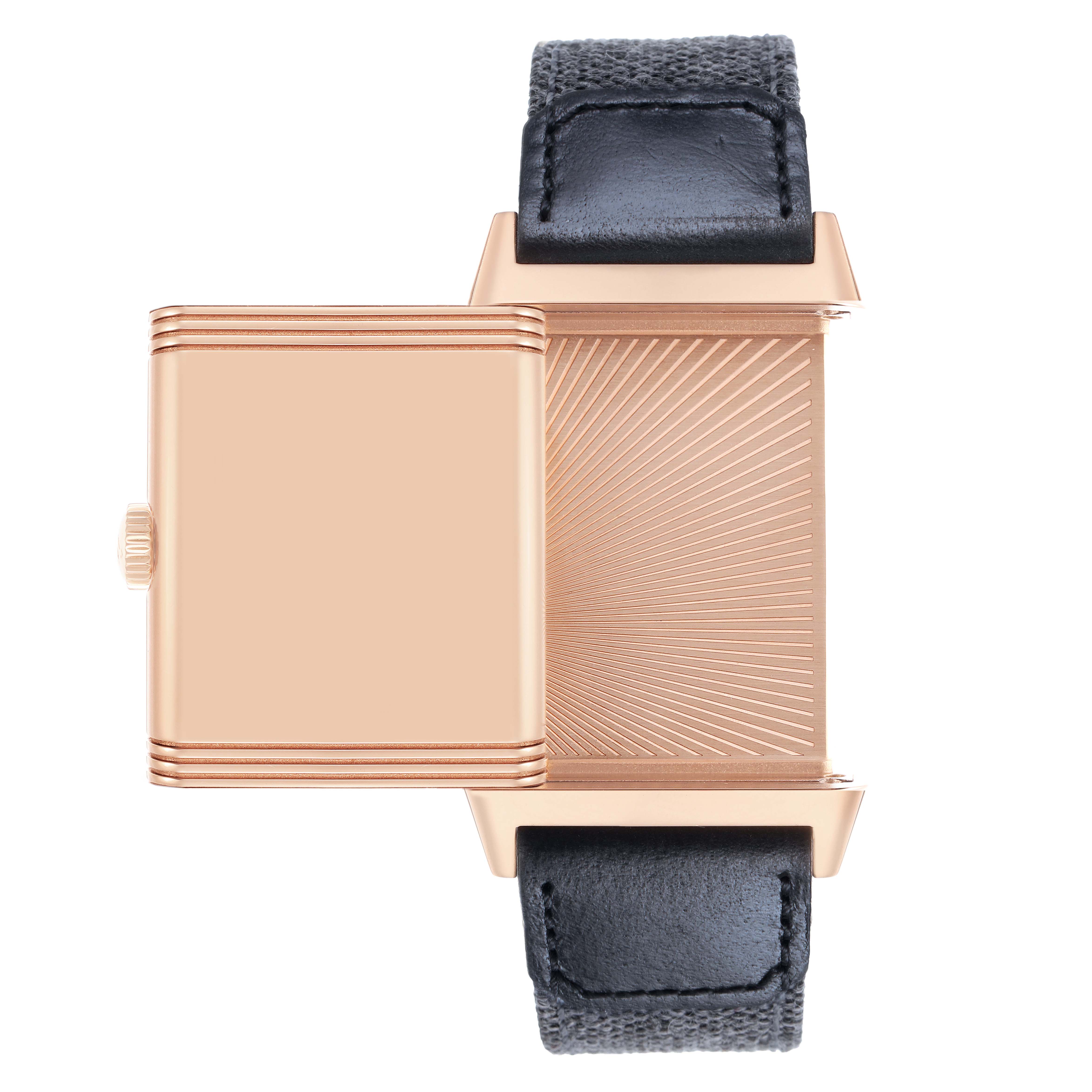 The Jaeger-LeCoultre Reverso watch is shown from a side angle with its case swivelled open, revealing the textured back.