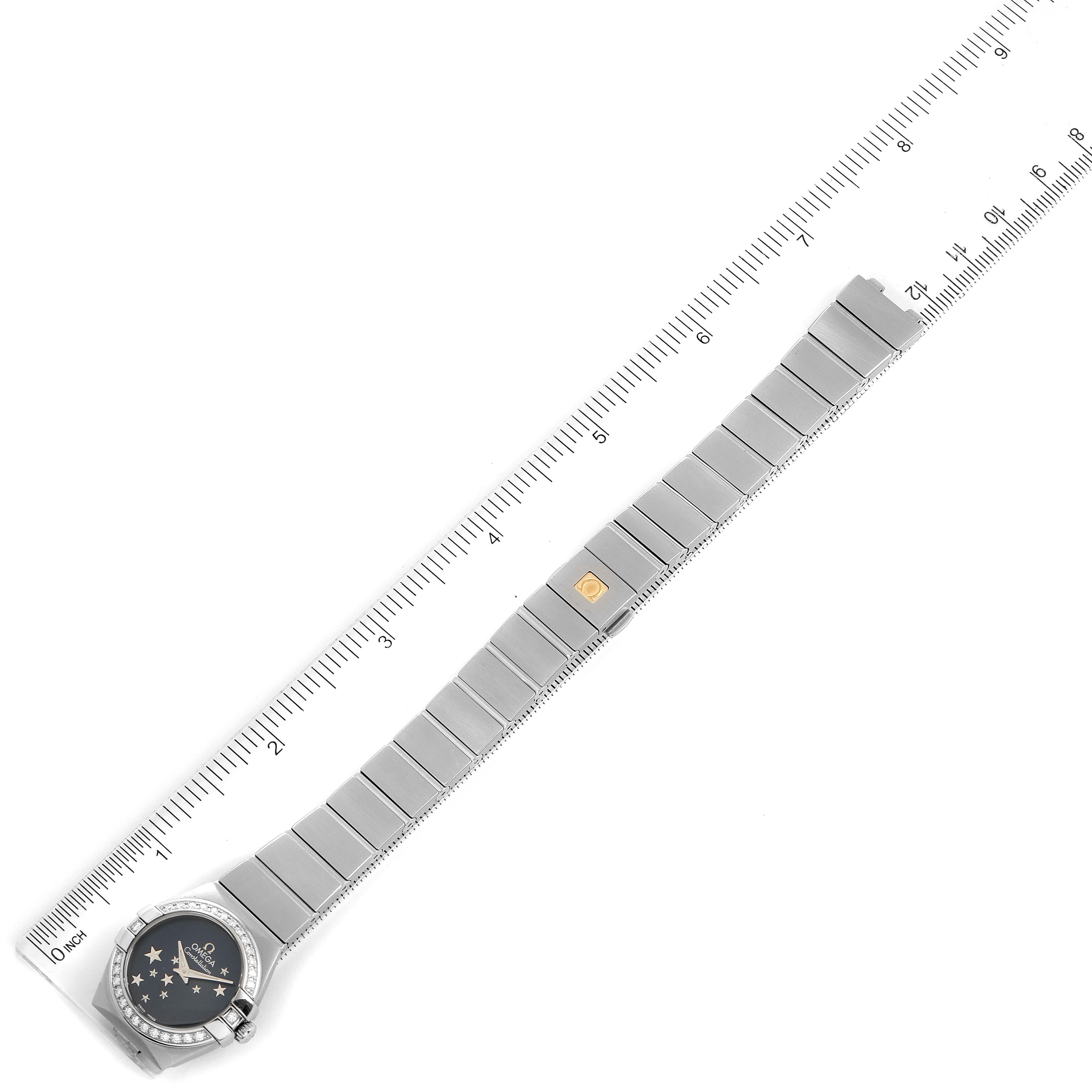 The image shows an overhead view of the Omega 123.15.24.60.03.001 Women's Stainless Steel Blue Dial 123.15.24.60.03.001 Women's Stainless Steel Blue Dial Constellation Orbis Star Steel Diamond Ladies Watch 123.15.24.60.03.001 fully extended with a ruler.