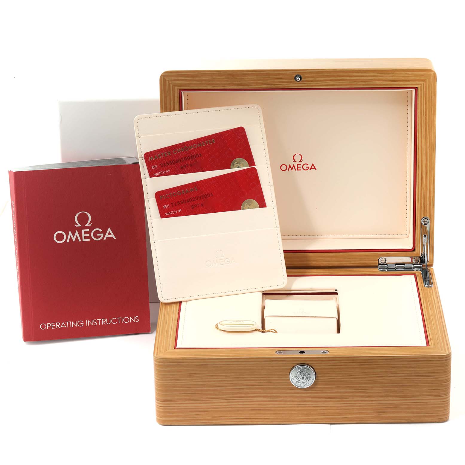 The image shows the box, operating instructions, and warranty cards for the Omega Planet Ocean 215.30.40.20.01.001 Men
s Stainless Steel Black Dial 215.30.40.20.01.001 Men
s Stainless Steel Black Dial watch.