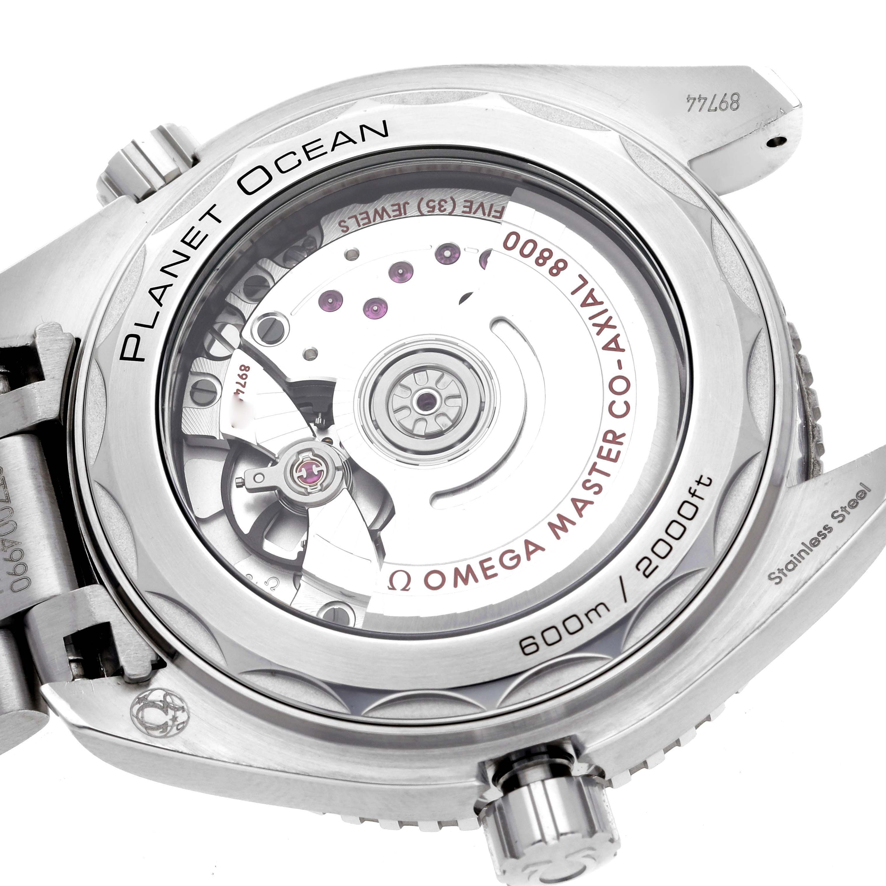 The image shows the back view of the Omega Planet Ocean 215.30.40.20.01.001 Men
s Stainless Steel Black Dial 215.30.40.20.01.001 Men
s Stainless Steel Black Dial watch, highlighting the movement and engravings on the case.