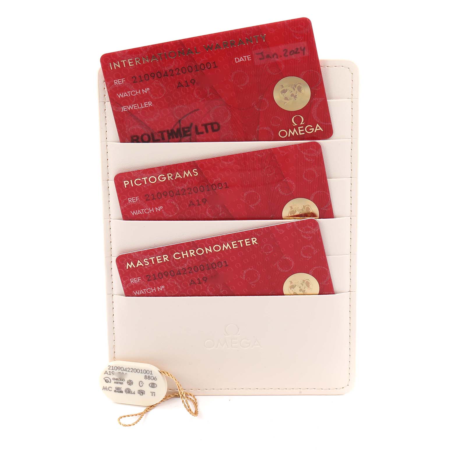 The image shows Omega Seamaster 210.90.42.20.01.001 Men
s Titanium Brown Dial warranty cards in a holder and a hang tag from a top-down angle.