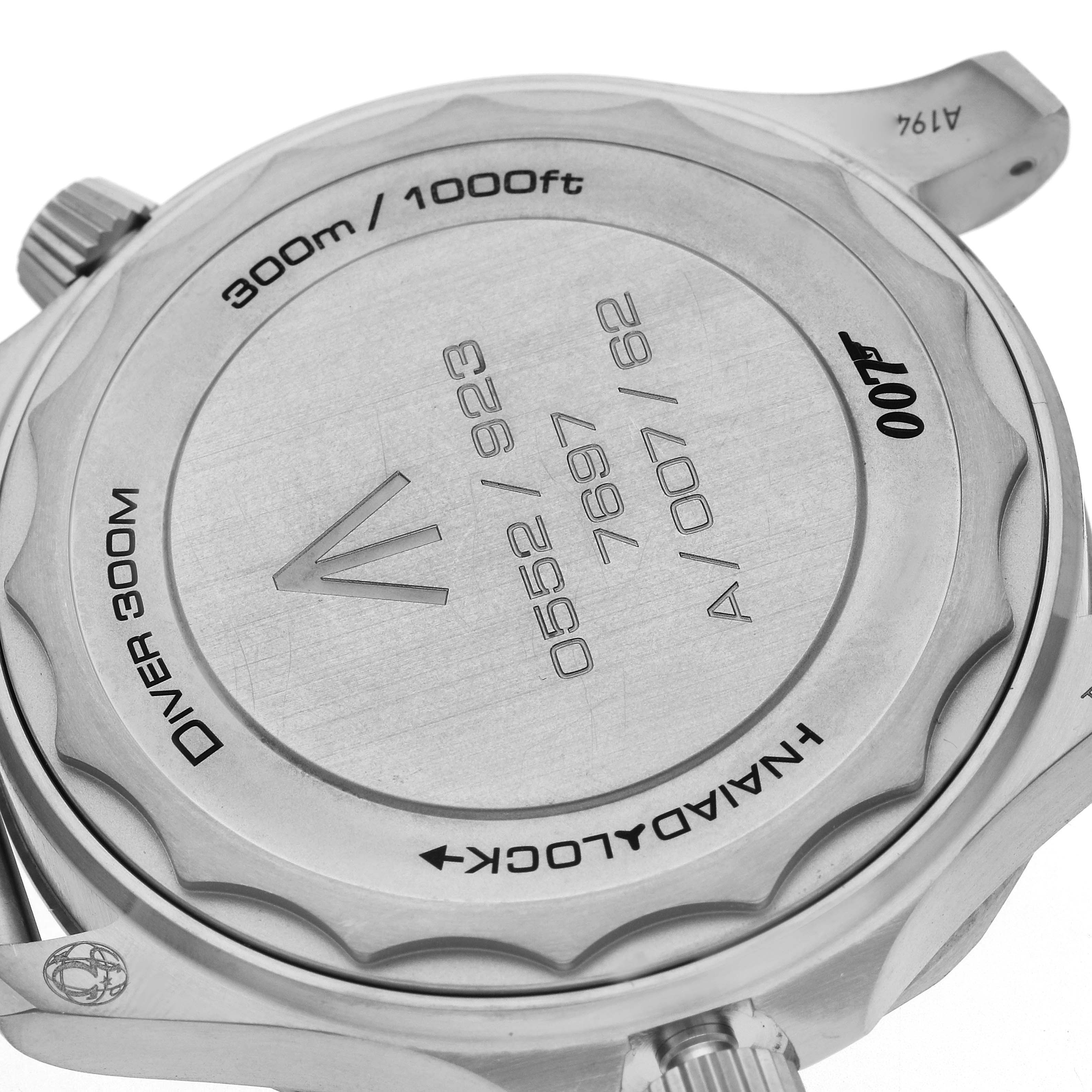 The image shows the back case of the Omega Seamaster 210.90.42.20.01.001 Men
s Titanium Brown Dial watch, displaying its engraving and the manual lock mechanism.