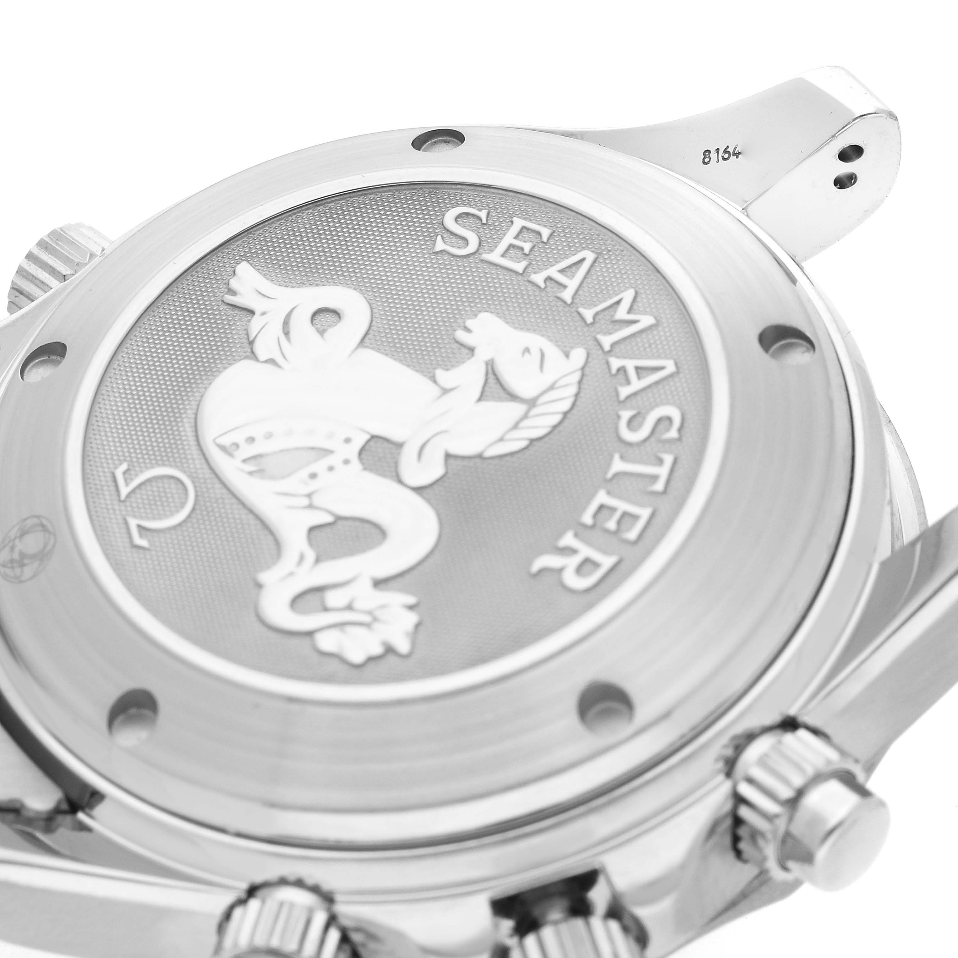 The image shows the back case of an Omega Seamaster 2225.80.00 Men
s Stainless Steel Blue Dial watch at an angled close-up, highlighting the logo and engravings.