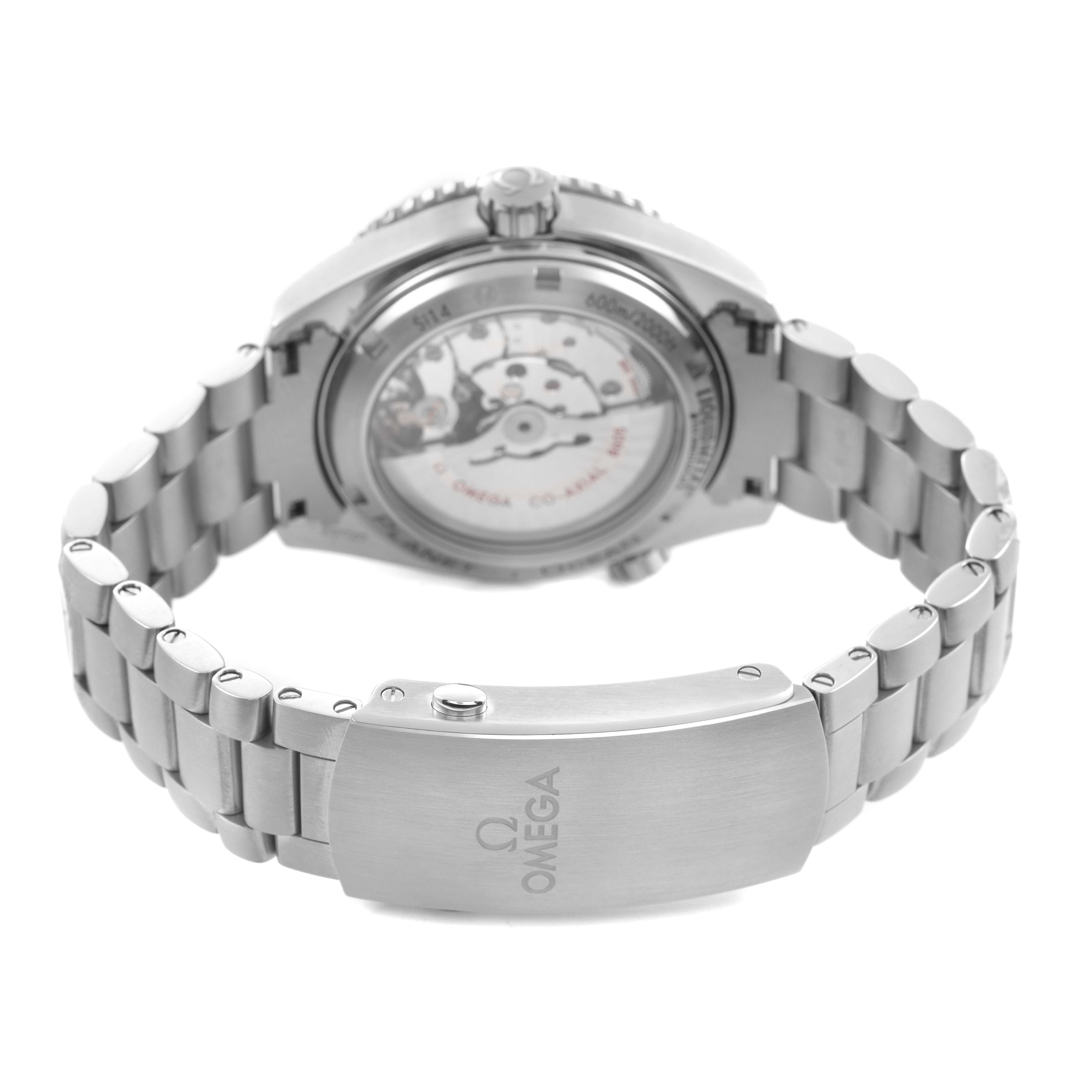 The image shows the back view of the Omega Planet Ocean 232.92.44.22.03.001 Men's Titanium Blue Dial watch, highlighting the stainless steel bracelet and transparent case back.