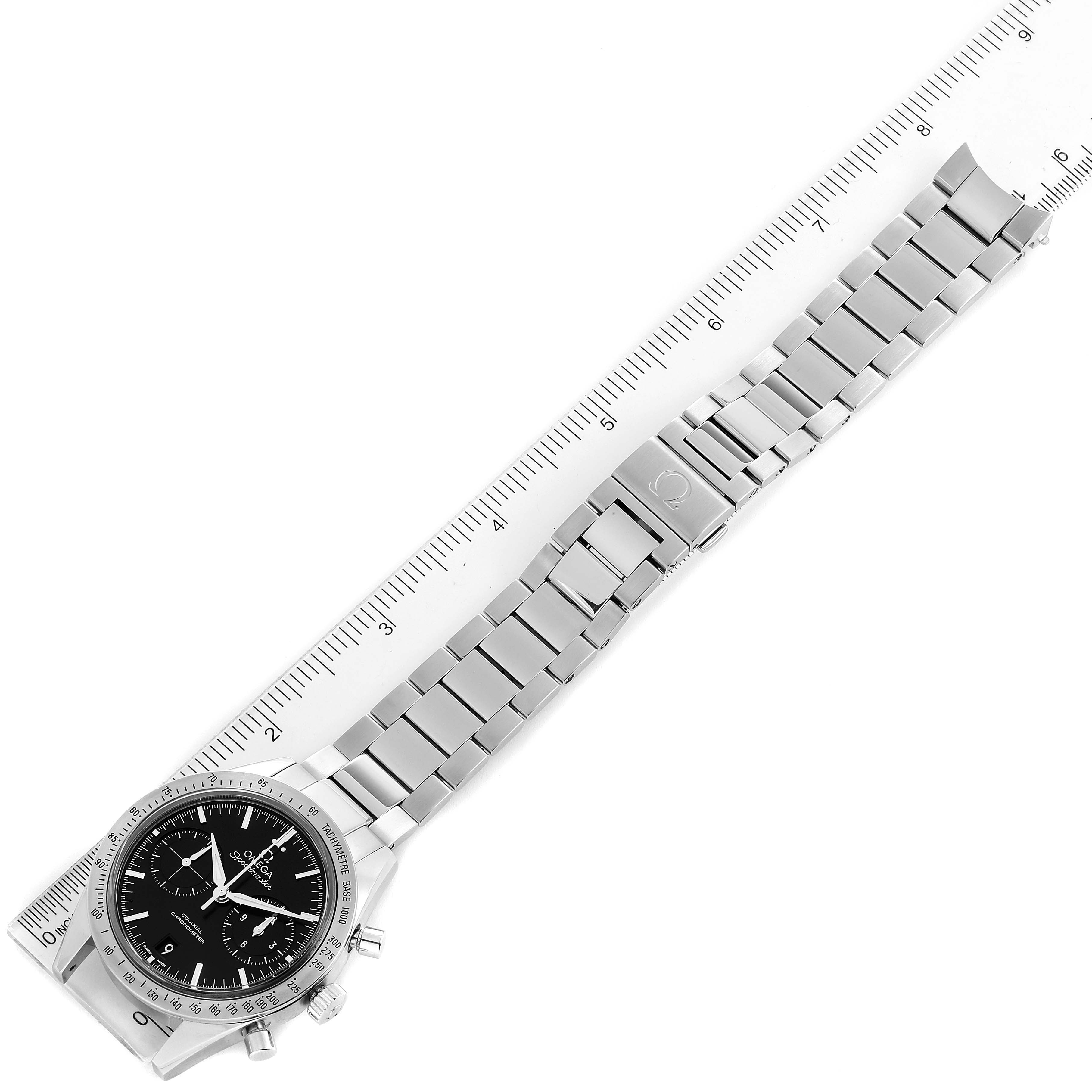 This image shows the Omega Speedmaster 331.10.42.51.01.001 Men
s Stainless Steel Black Dial 331.10.42.51.01.001 Men
s Stainless Steel Black Dial watch lying flat, displaying its face, bracelet, and clasp alongside a ruler.