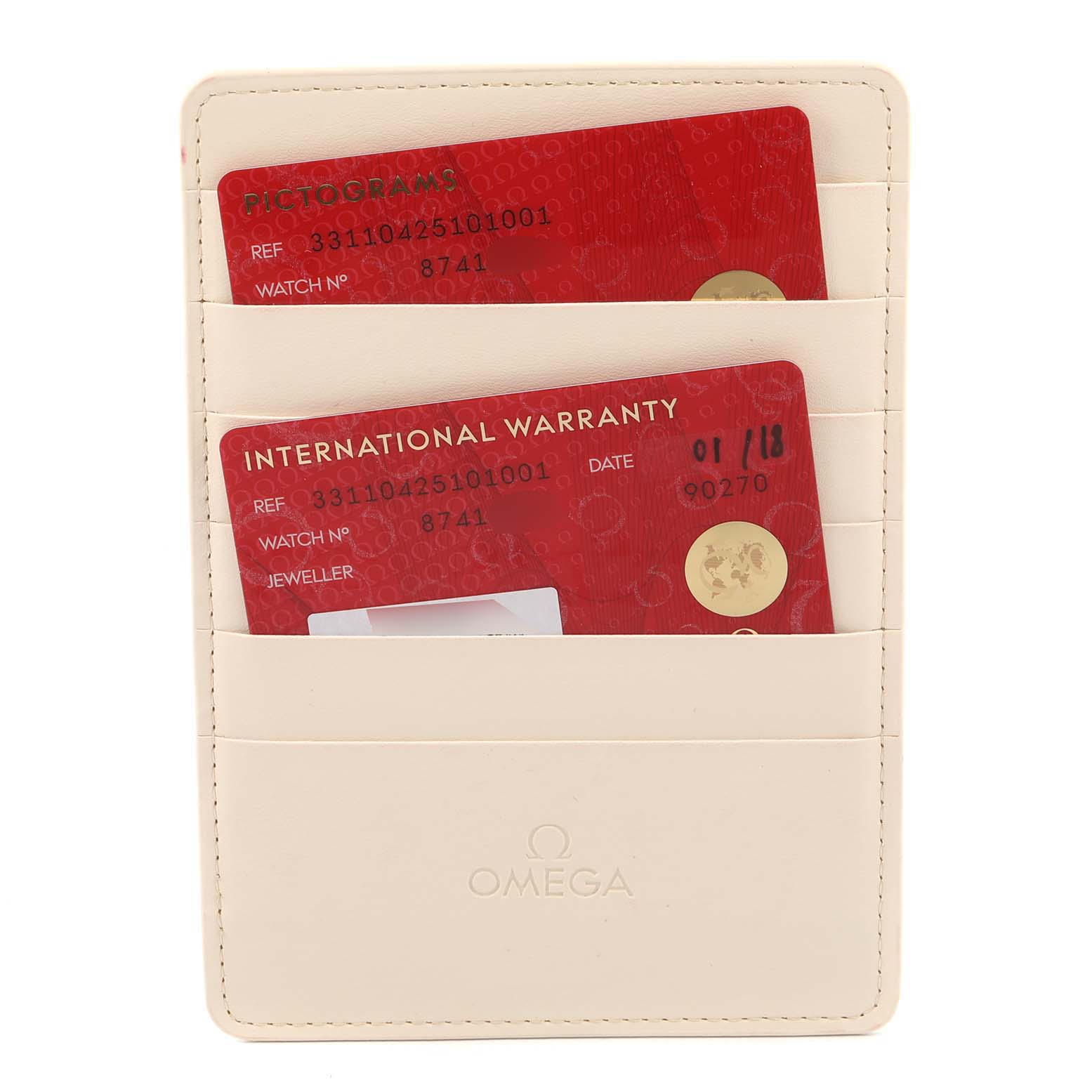 The image shows an Omega cardholder holding two cards: a pictograms card and an international warranty card for the Speedmaster model.