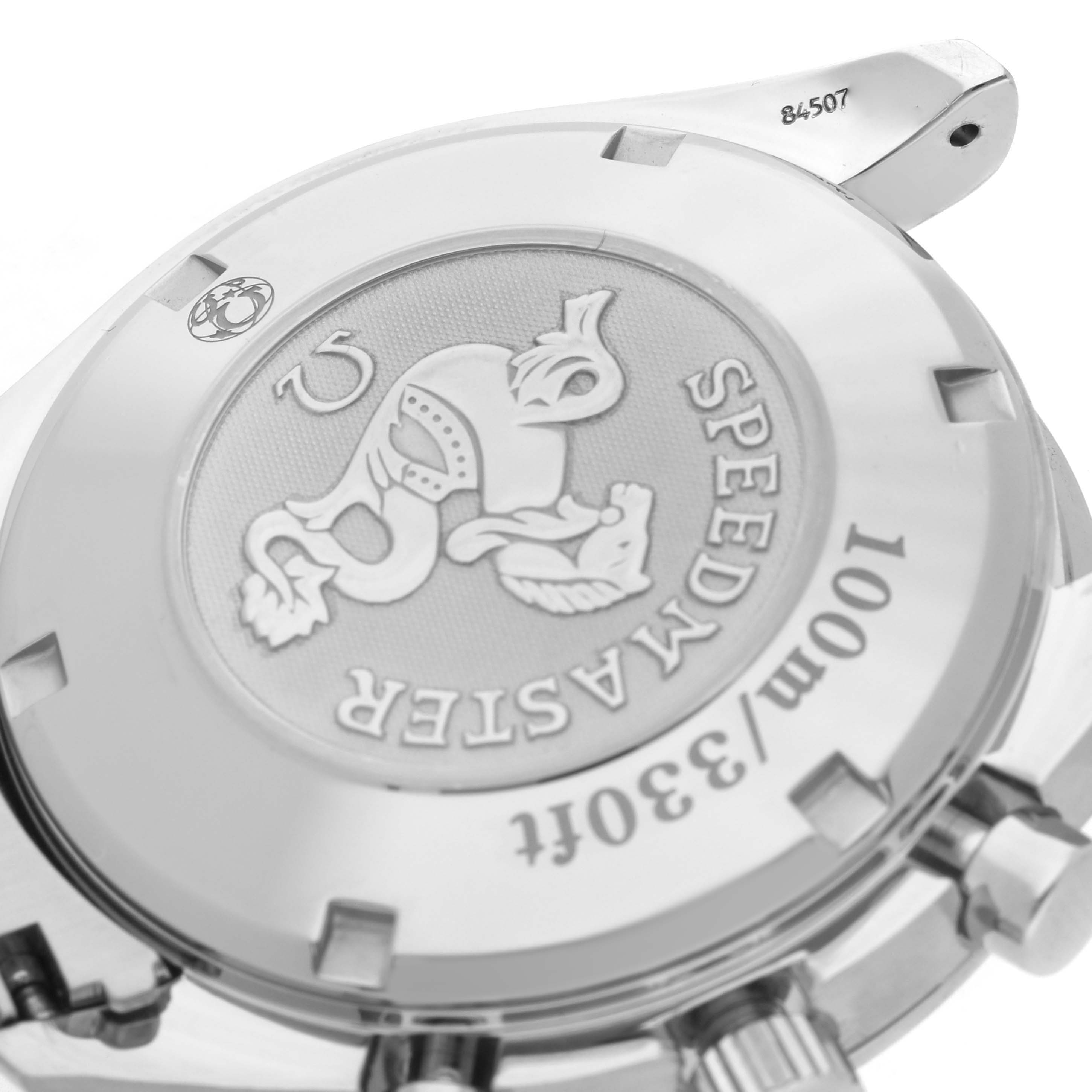 The image shows the back case of the Omega Speedmaster 3210.51.00 Men
s Stainless Steel Black Dial, highlighting the embossed emblem and water resistance details.