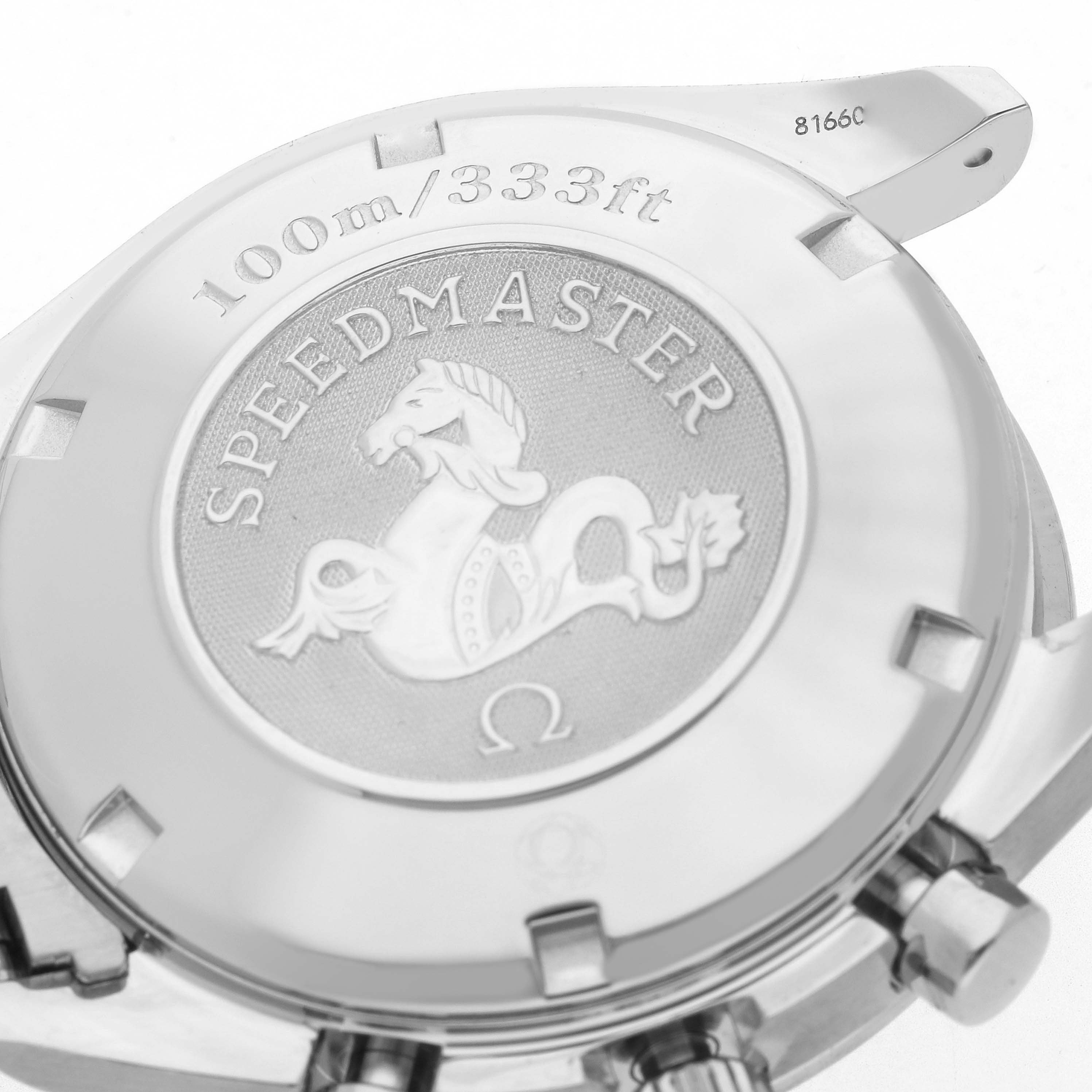 The image shows the case back of an Omega Speedmaster 3210.51.00 Men
s Stainless Steel Black Dial watch, displaying the logo and water resistance marking at an angled view.