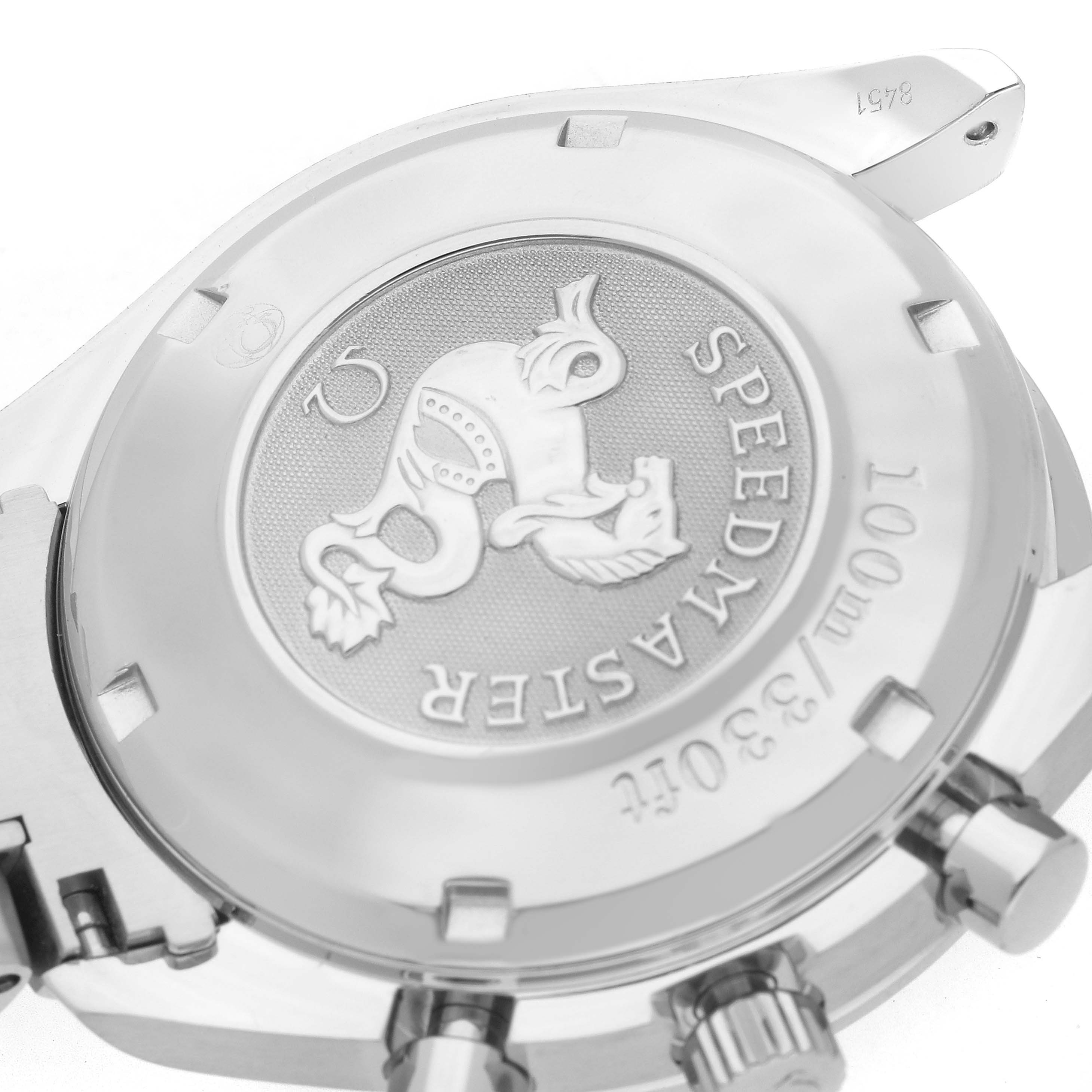 The image shows the back casing of an Omega Speedmaster 3220.50.00 Men
s Stainless Steel Black Dial watch with branding and decorative engraving.