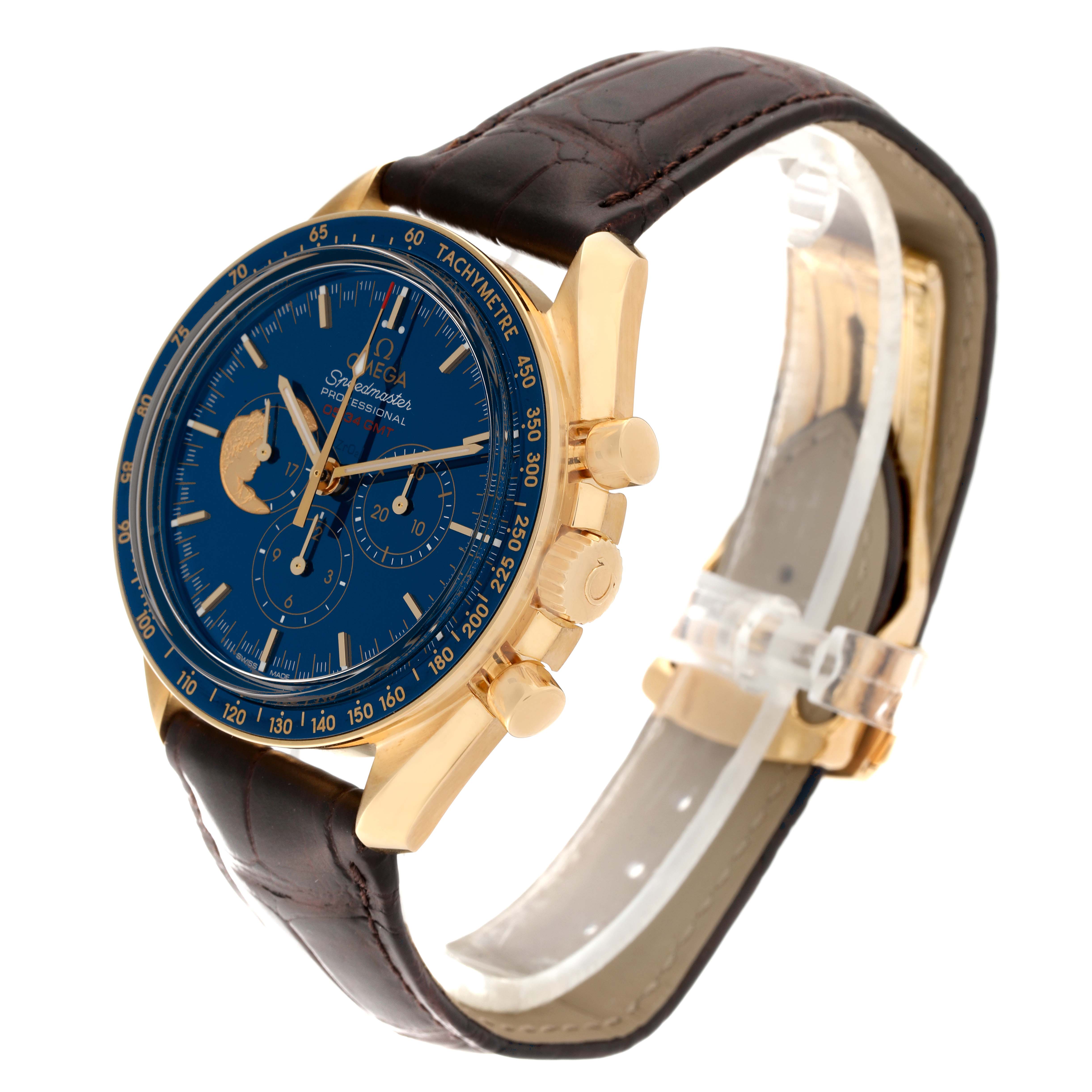 The Omega Speedmaster 311.63.42.30.03.001 Men's Yellow Gold Blue Dial 311.63.42.30.03.001 Men's Yellow Gold Blue Dial watch is shown from a three-quarter angle, highlighting the face, bezel, crown, and brown leather strap.