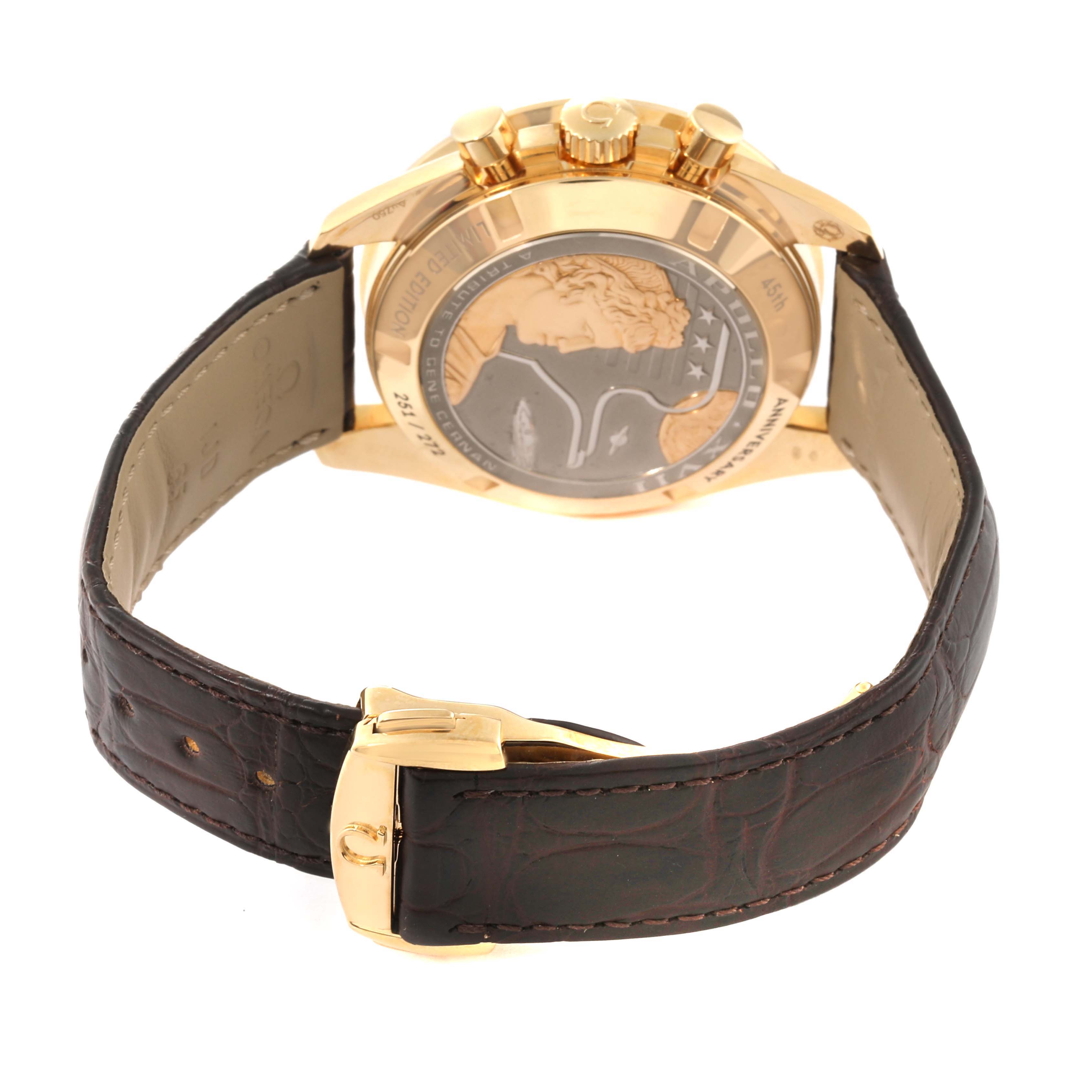 This image shows the back case, crown, and leather strap of an Omega Speedmaster 311.63.42.30.03.001 Men's Yellow Gold Blue Dial 311.63.42.30.03.001 Men's Yellow Gold Blue Dial watch.