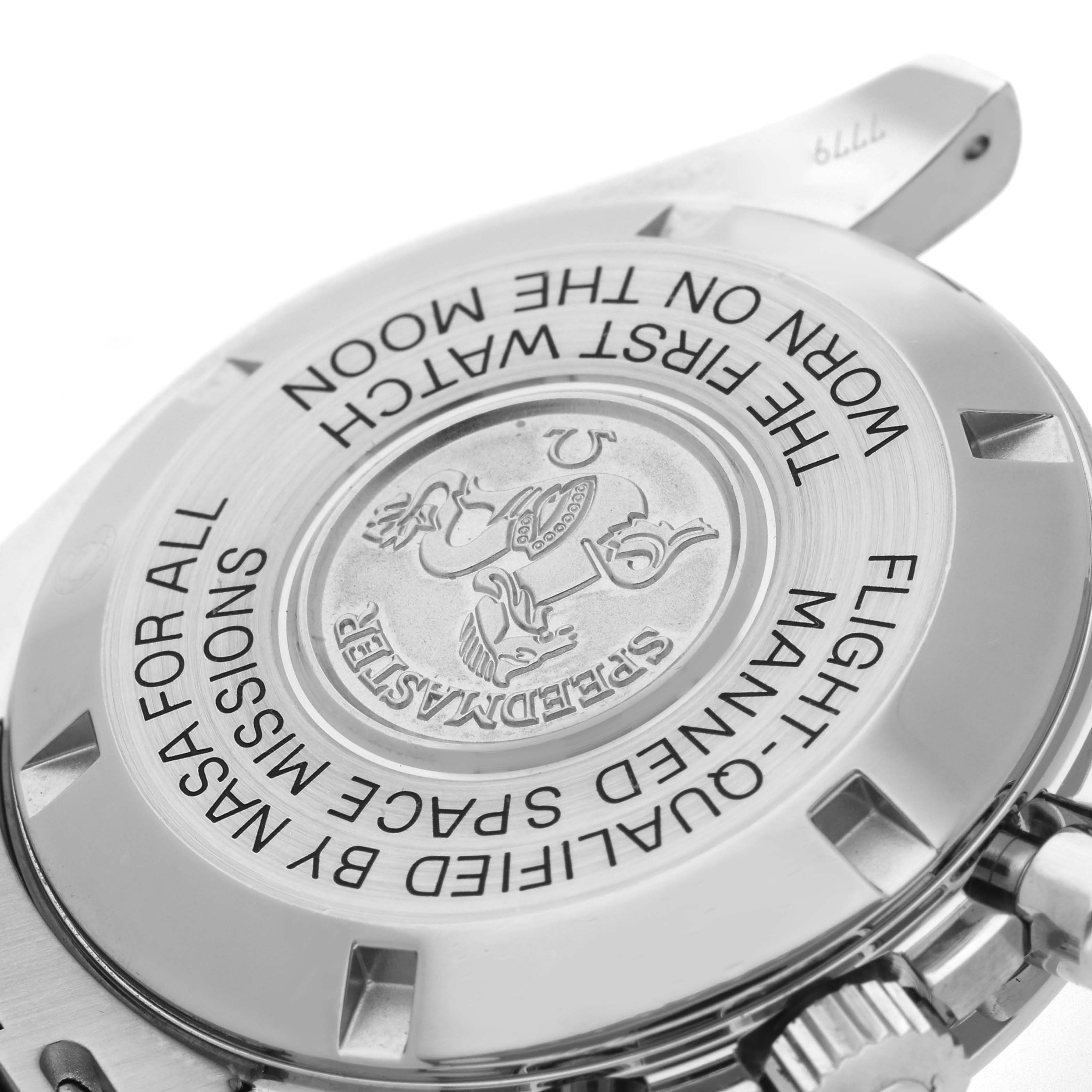 The Omega Speedmaster 3570.50.00 Men
s Stainless Steel Black Dial watch is shown from the back angle, highlighting the engraved case back and the partial view of the crown.