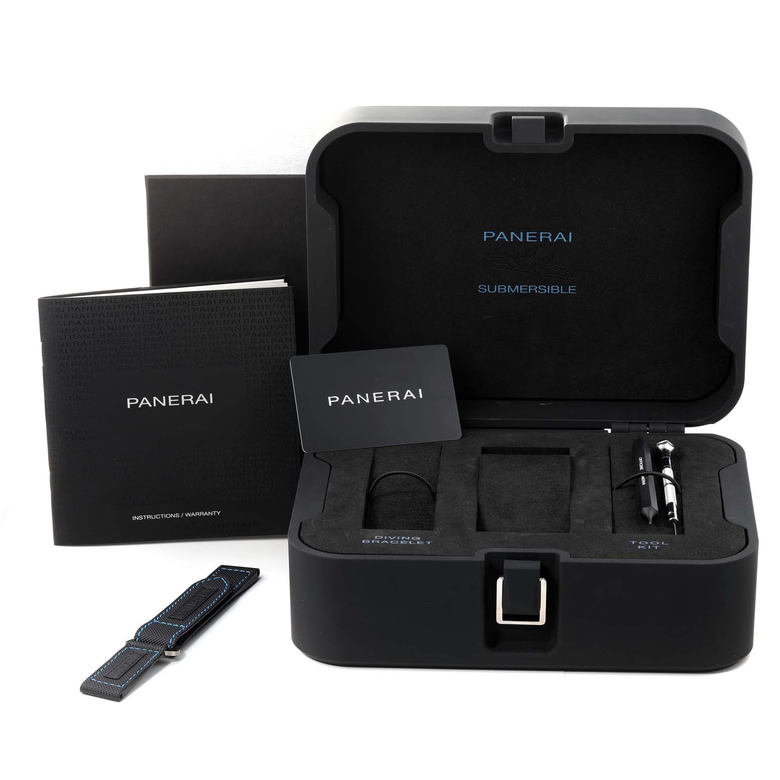 The image shows an open Panerai Submersible PAM00683 Men
s Stainless Steel Black Dial PAM00683 Men
s Stainless Steel Black Dial watch box, instruction booklets, a spare strap, and a tool inside the box.