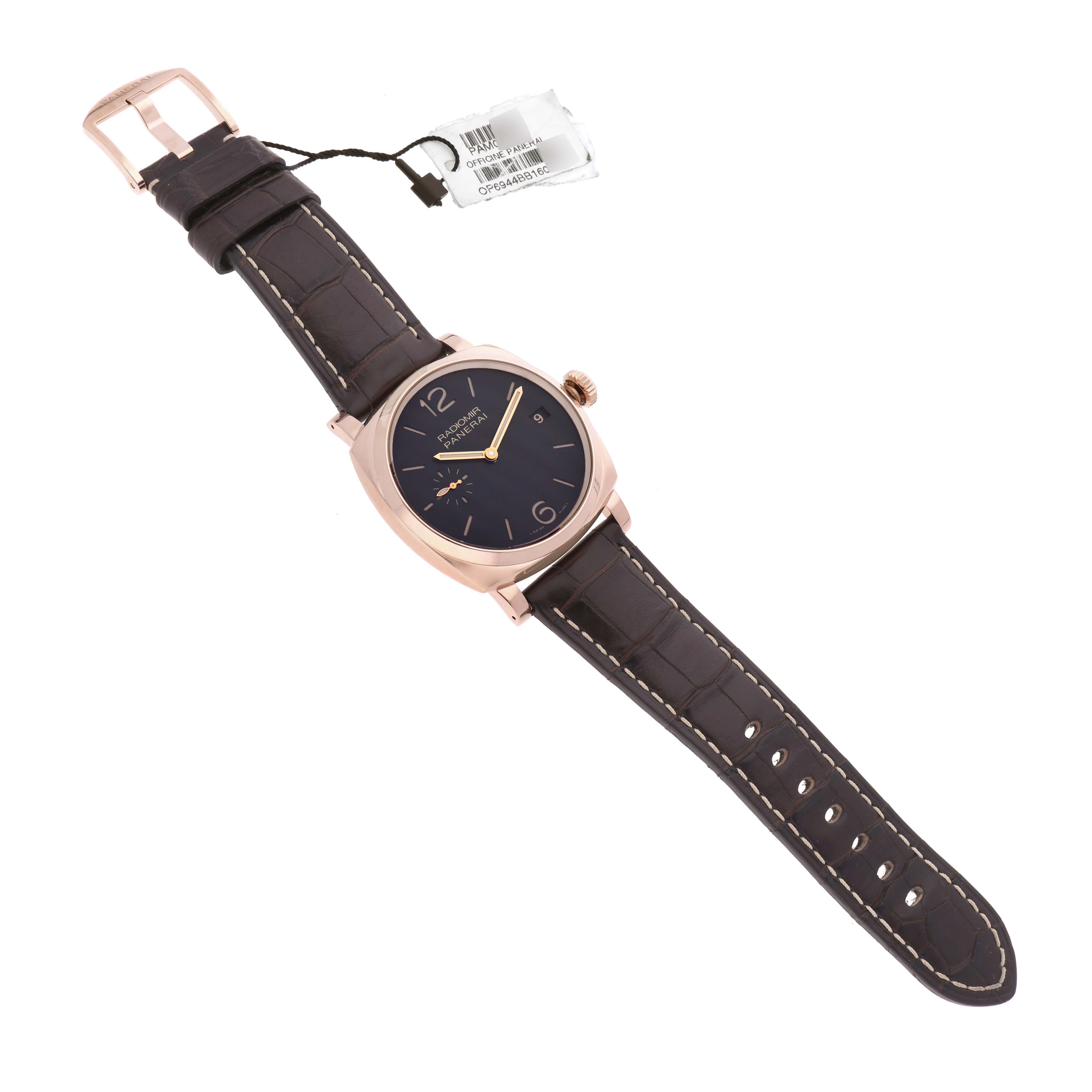 The Panerai Radiomir PAM00515 Men's Rose Gold Black Dial watch is shown from a top-down angle, highlighting its face, strap, and buckle.