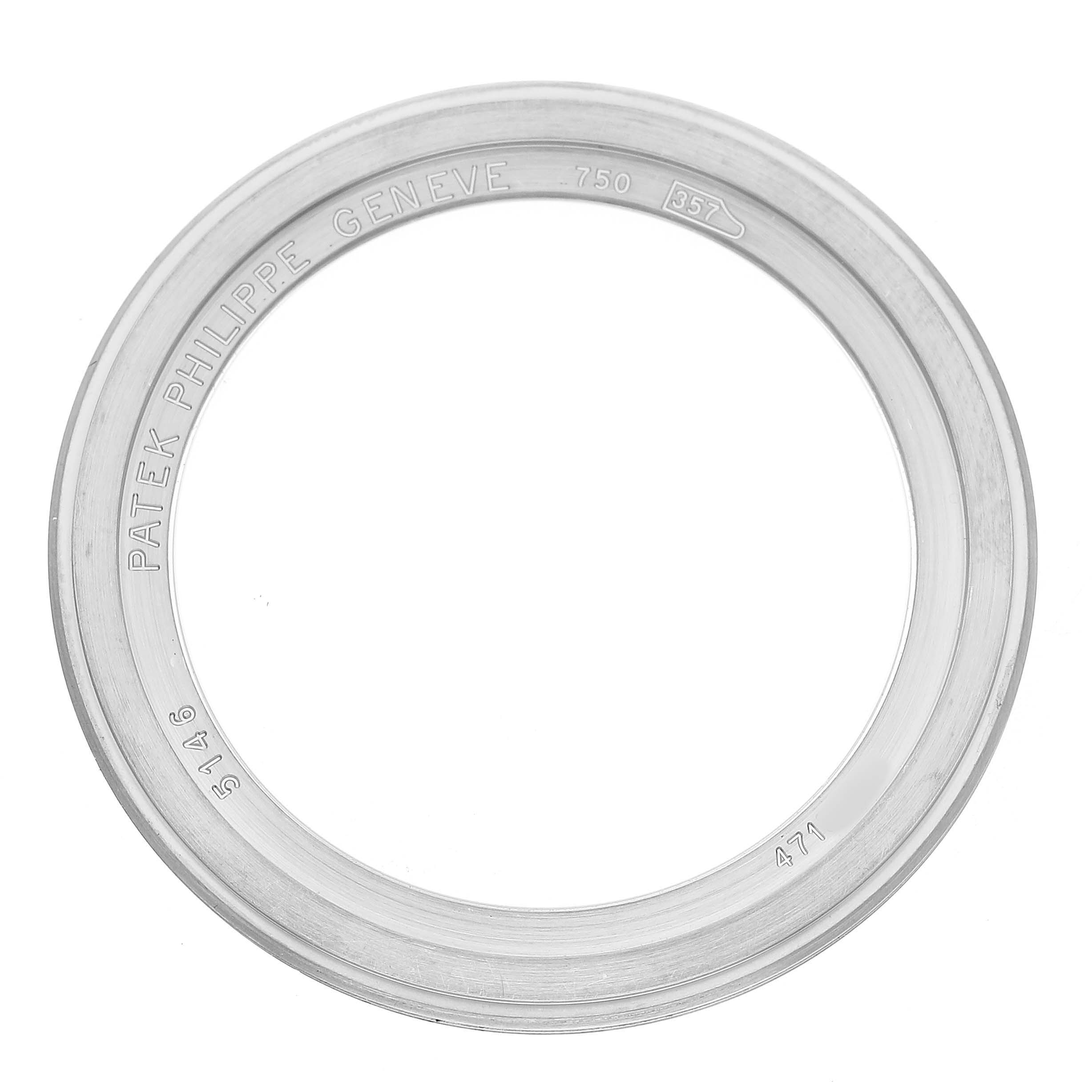 The image shows a bezel ring from the Patek Philippe Complications 5146G-001 Men's White Gold Grey Dial watch, viewed from above, displaying engraved details.