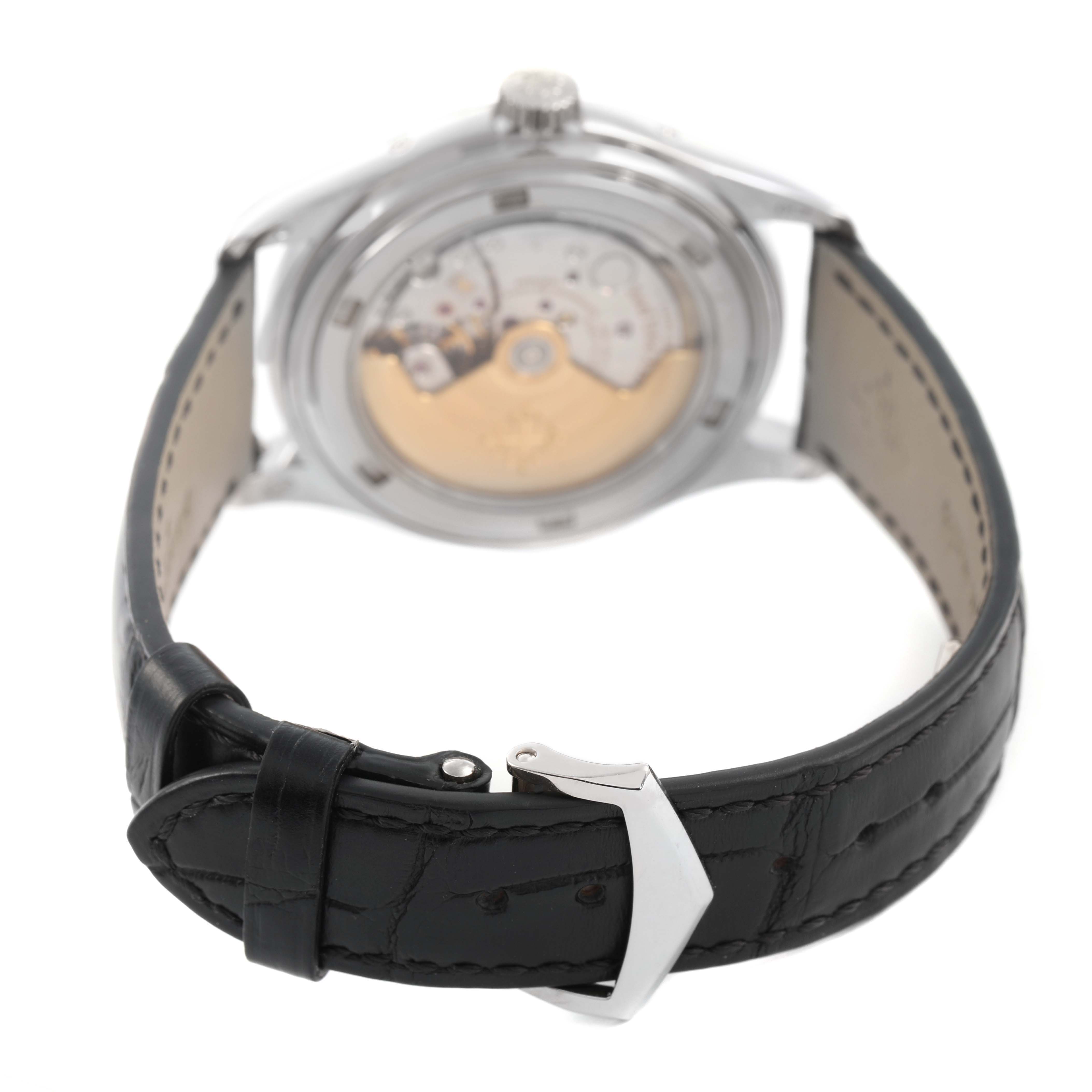 The image shows the back view of a Patek Philippe Complications 5146G-001 Men's White Gold Grey Dial watch, highlighting its open case back and black leather strap.