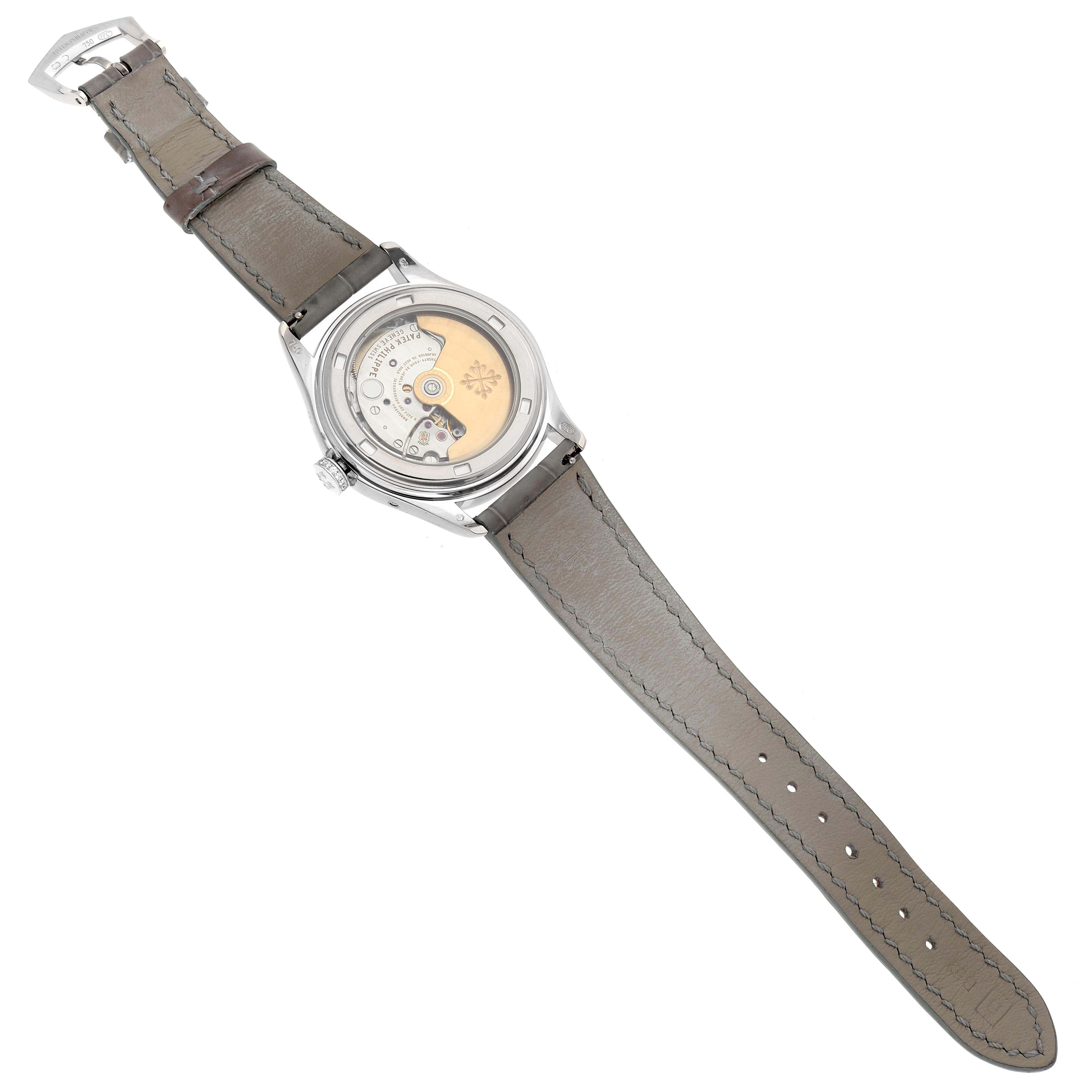 The Patek Philippe Complications 4936 Men
s White Gold Mother of Pearl Dial watch is shown from the back, highlighting its movement and transparent case back.