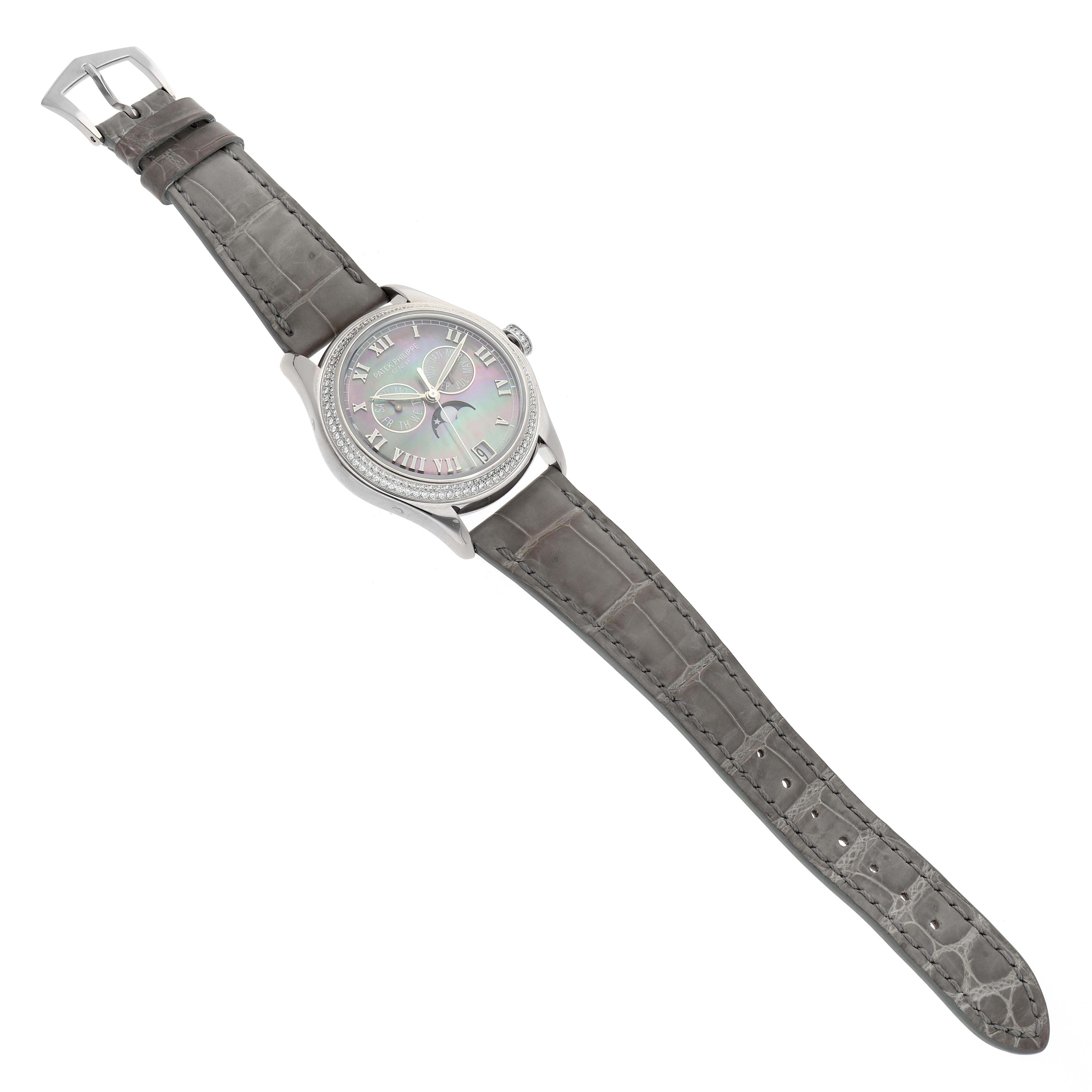 The Patek Philippe Complications 4936 Men
s White Gold Mother of Pearl Dial watch is shown from a top-down angle, displaying the face, case, and full strap.