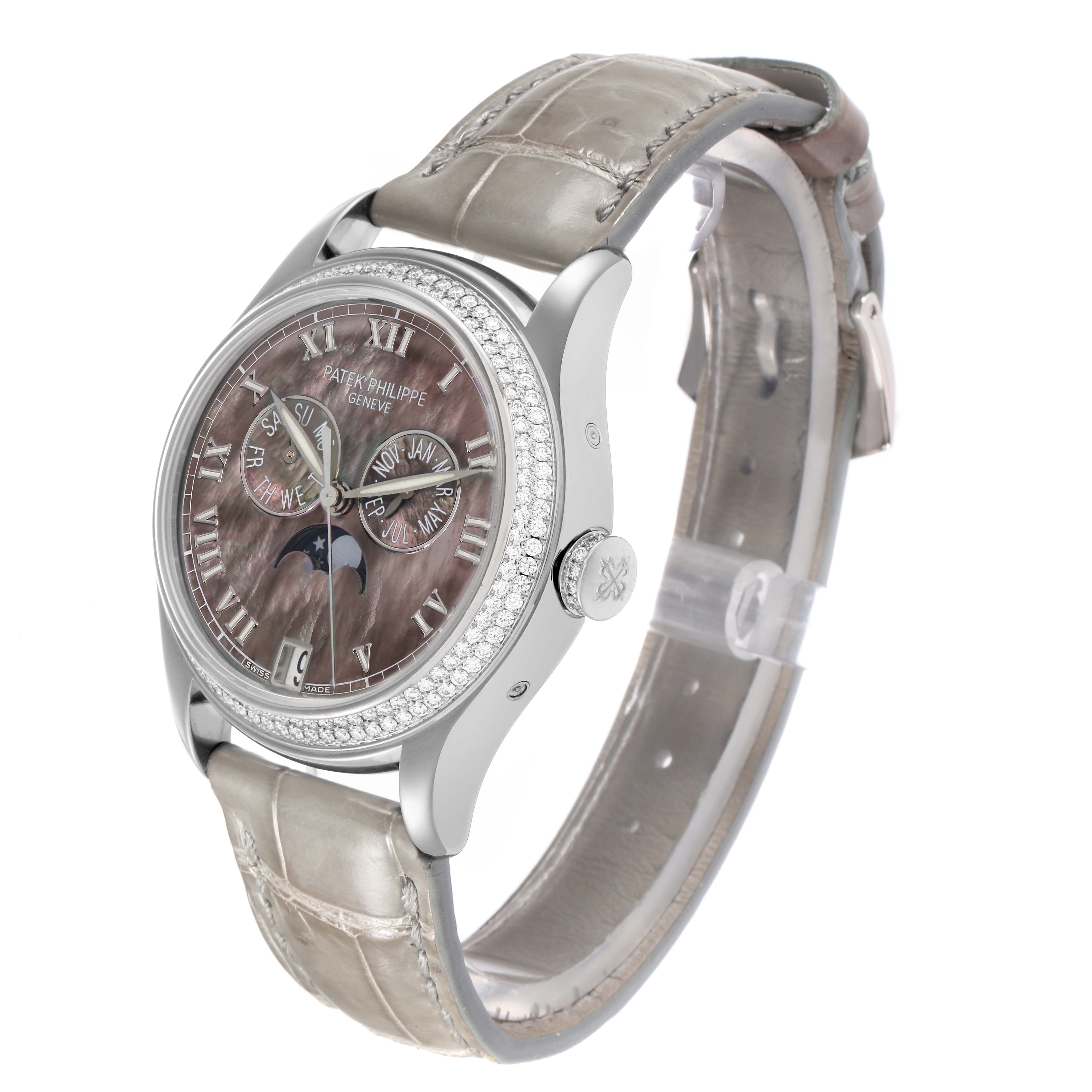 The Patek Philippe Complications 4936 Men
s White Gold Mother of Pearl Dial watch is shown at an angled side view, highlighting the dial, bezel, case, and strap.