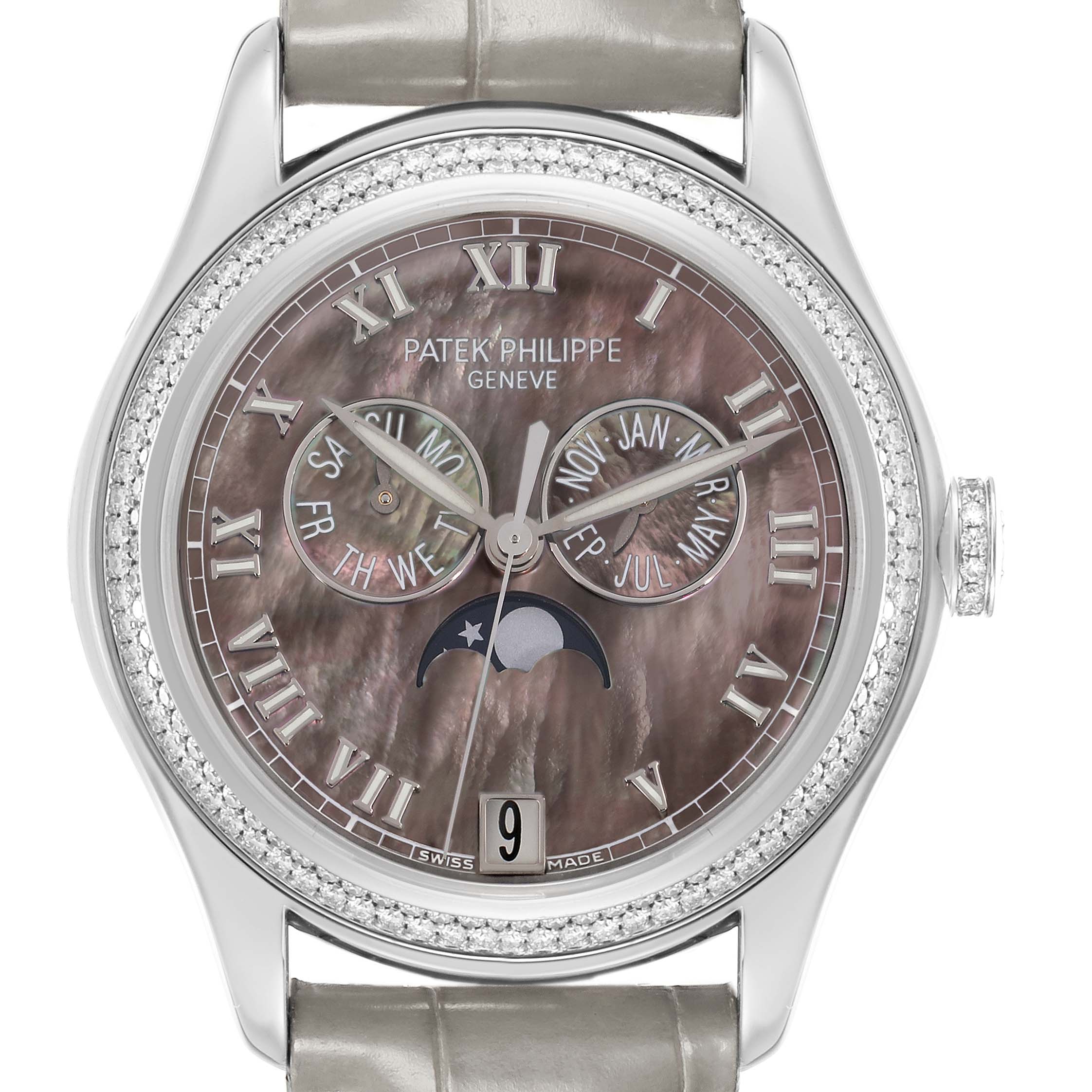 The Patek Philippe Complications 4936 Men
s White Gold Mother of Pearl Dial watch is shown from the front, displaying its dial, moon phase, day, date, month indicators, and bejeweled bezel.