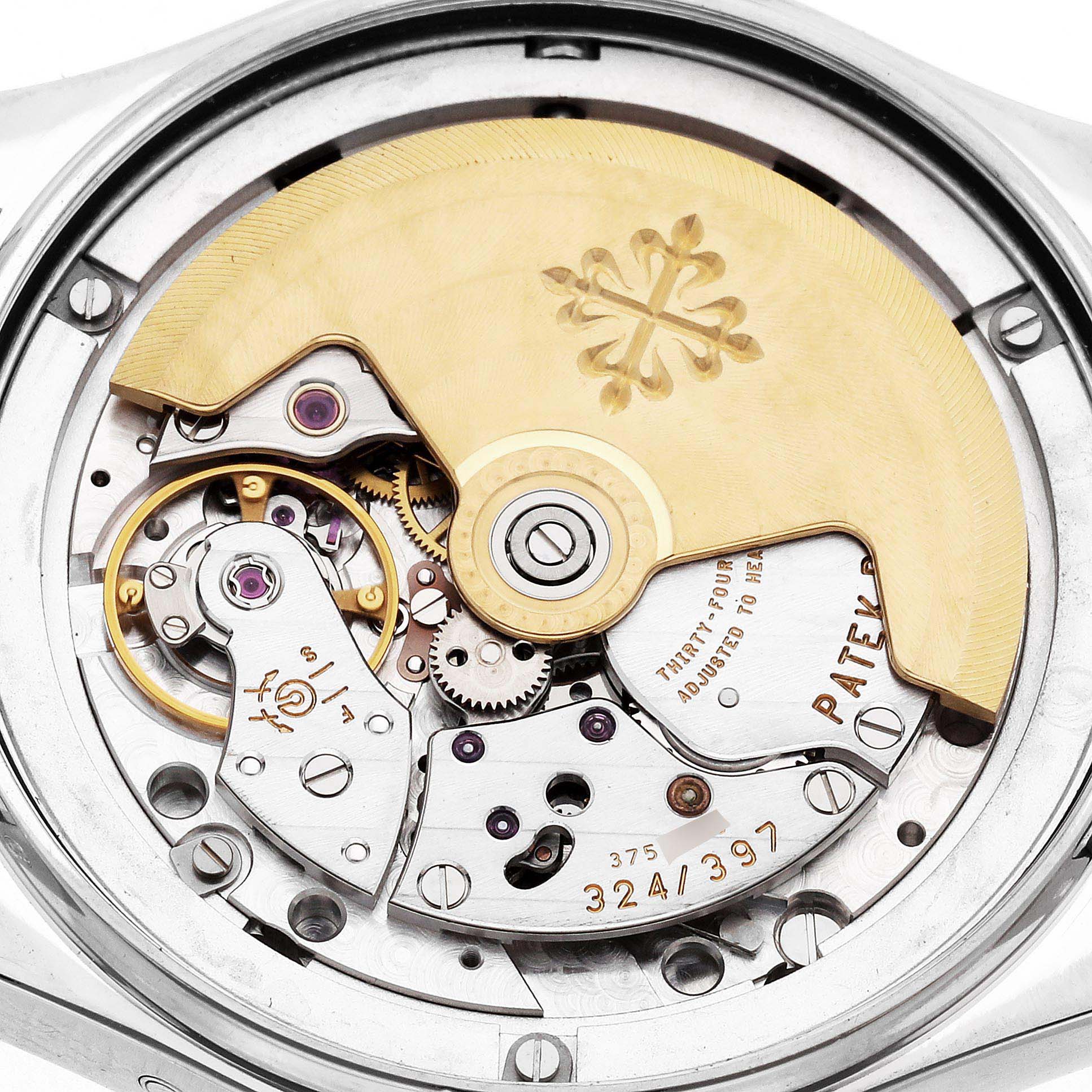 The image shows the back view of the Patek Philippe Complications 4936 Men
s White Gold Mother of Pearl Dial, focusing on the intricate movement and gold rotor.