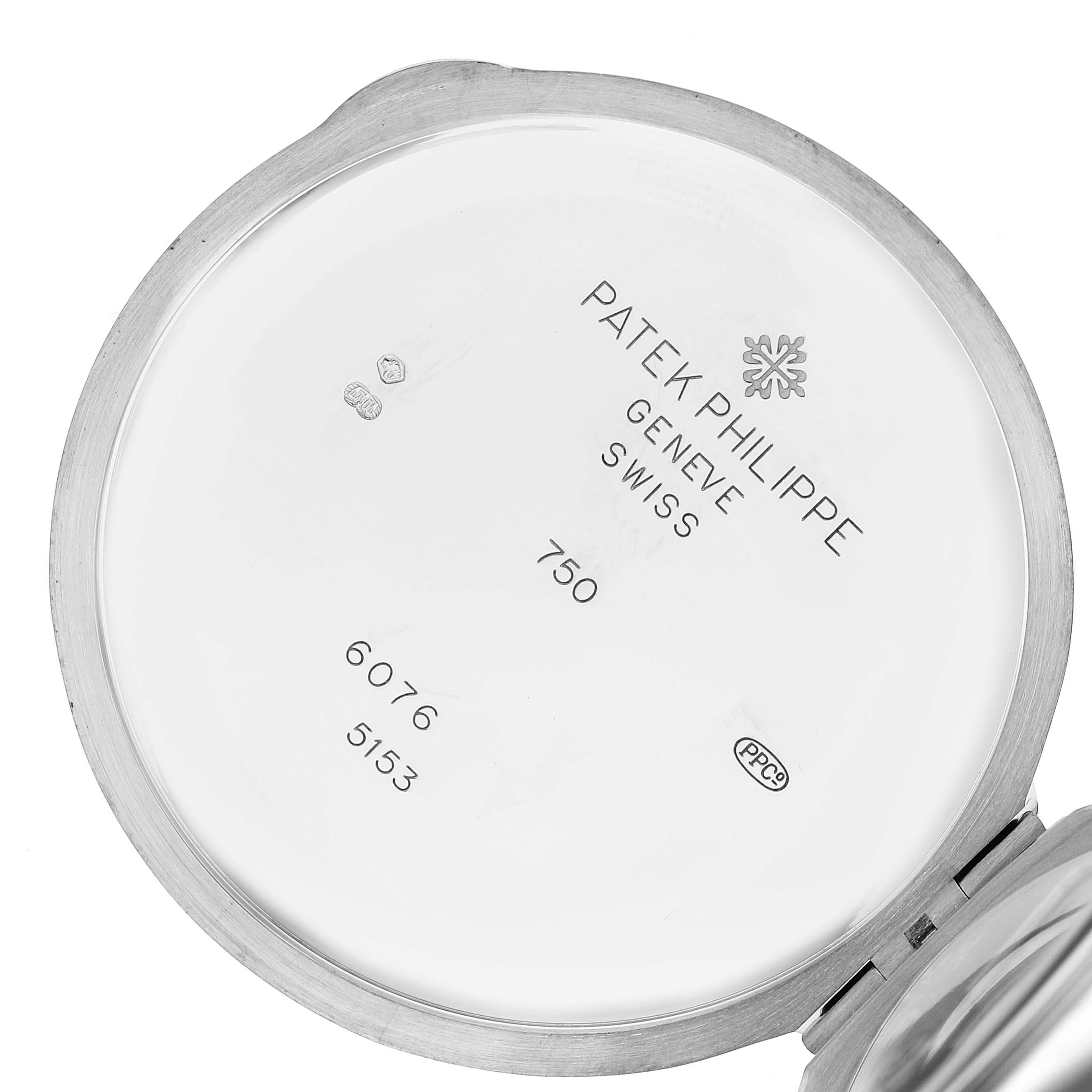 This image shows the inside of the case back of a Patek Philippe Calatrava 5153G Men's White Gold Black Dial 5153G Men's White Gold Black Dial watch, revealing its inscriptions and hallmarks.