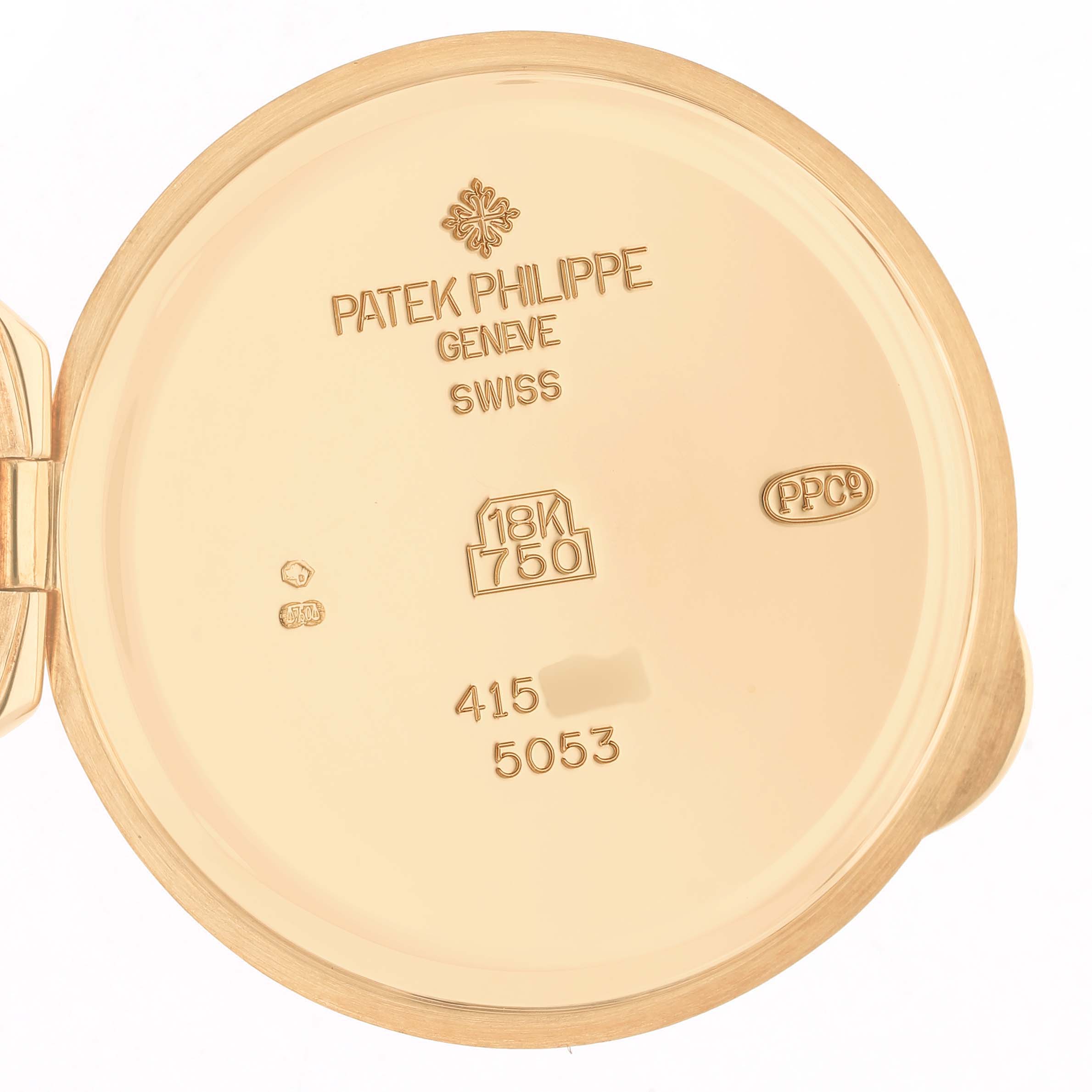 The image shows the case back interior of a Patek Philippe Calatrava 5053J Men's Yellow Gold White Dial, displaying engravings and hallmarks.