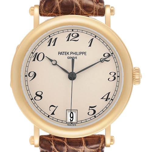 The image shows a front view of a Patek Philippe Calatrava 5053J Men's Yellow Gold White Dial watch, highlighting its dial, numerals, and leather strap.
