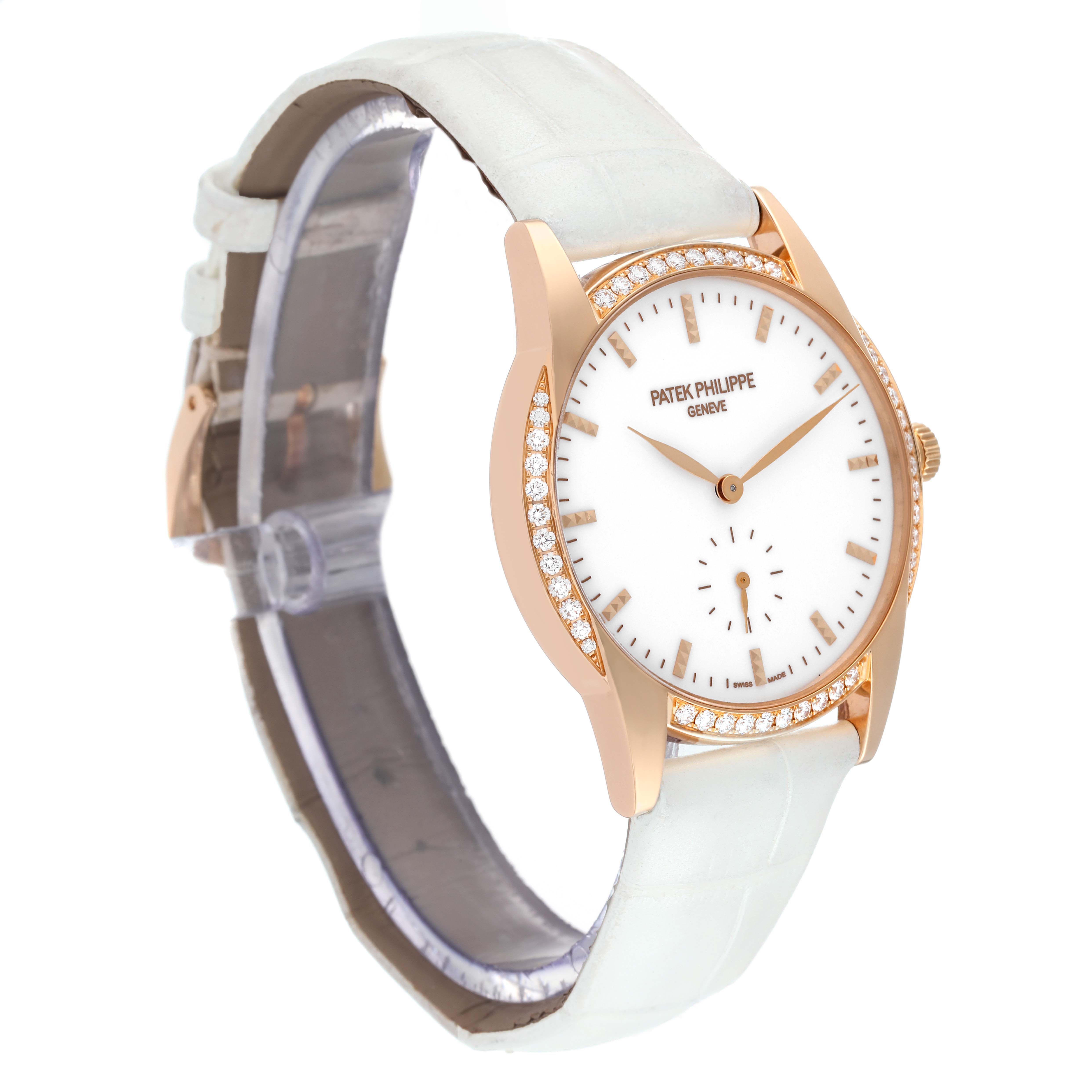 The image shows a side angled view of a Patek Philippe Calatrava 7122/200R Women's Rose Gold White Dial 7122/200R Women's Rose Gold White Dial watch, featuring the dial, case, and white strap.