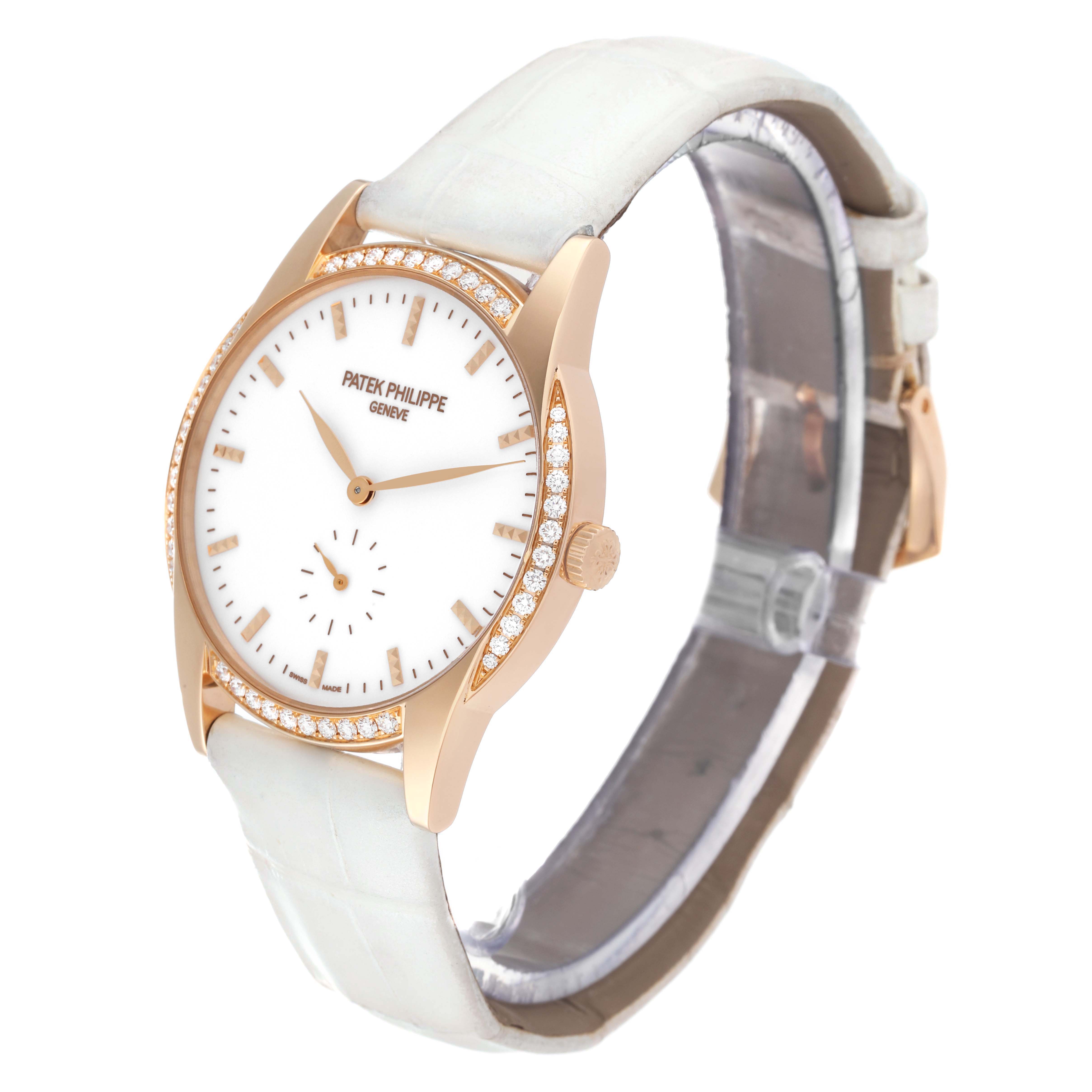 The image shows a Patek Philippe Calatrava 7122/200R Women's Rose Gold White Dial 7122/200R Women's Rose Gold White Dial watch at a 3/4 angle, displaying its face, bezel, crown, and strap.