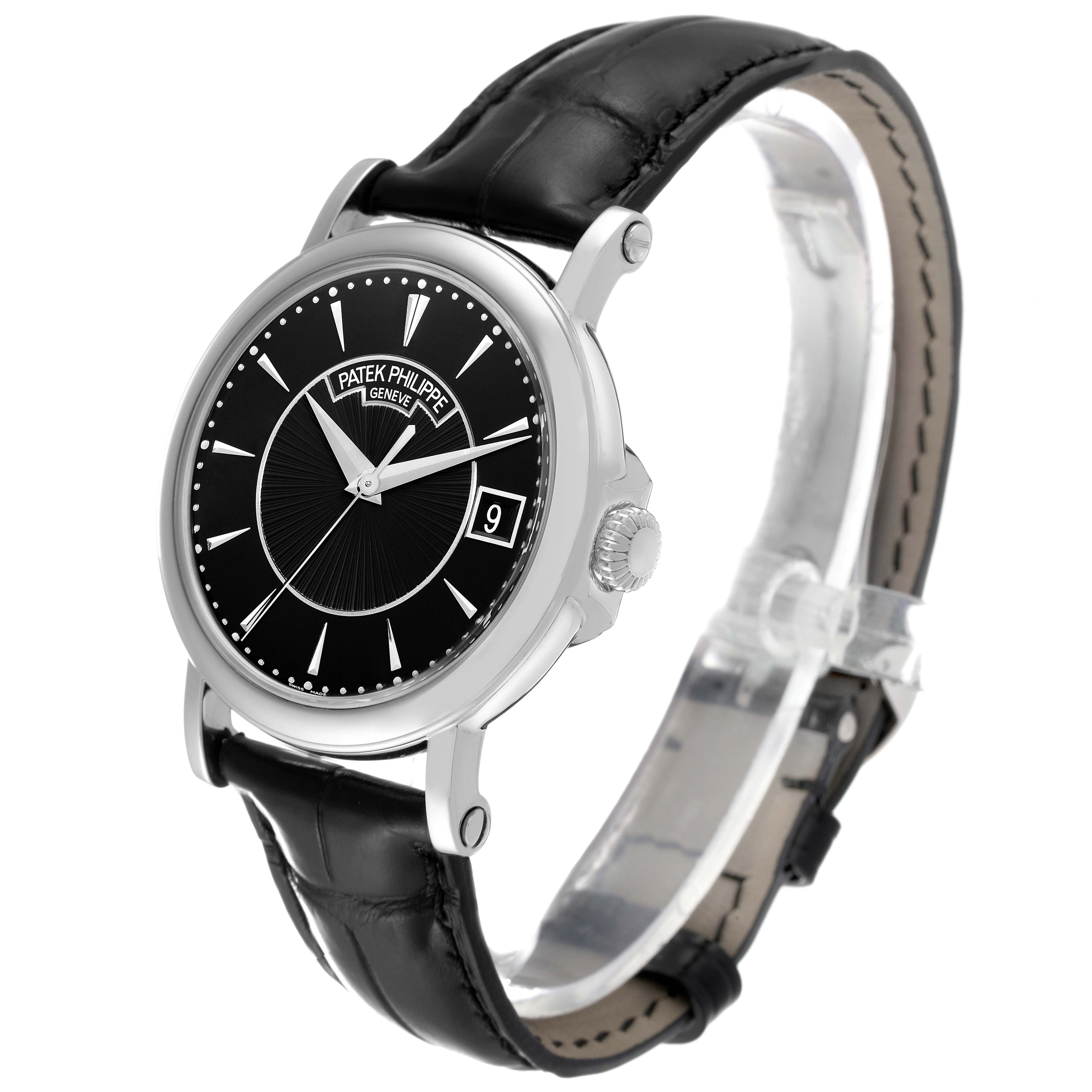 The Patek Philippe Calatrava 5153G Men's White Gold Black Dial watch is shown at a slight side angle, highlighting the black dial, silver markers, and leather strap.