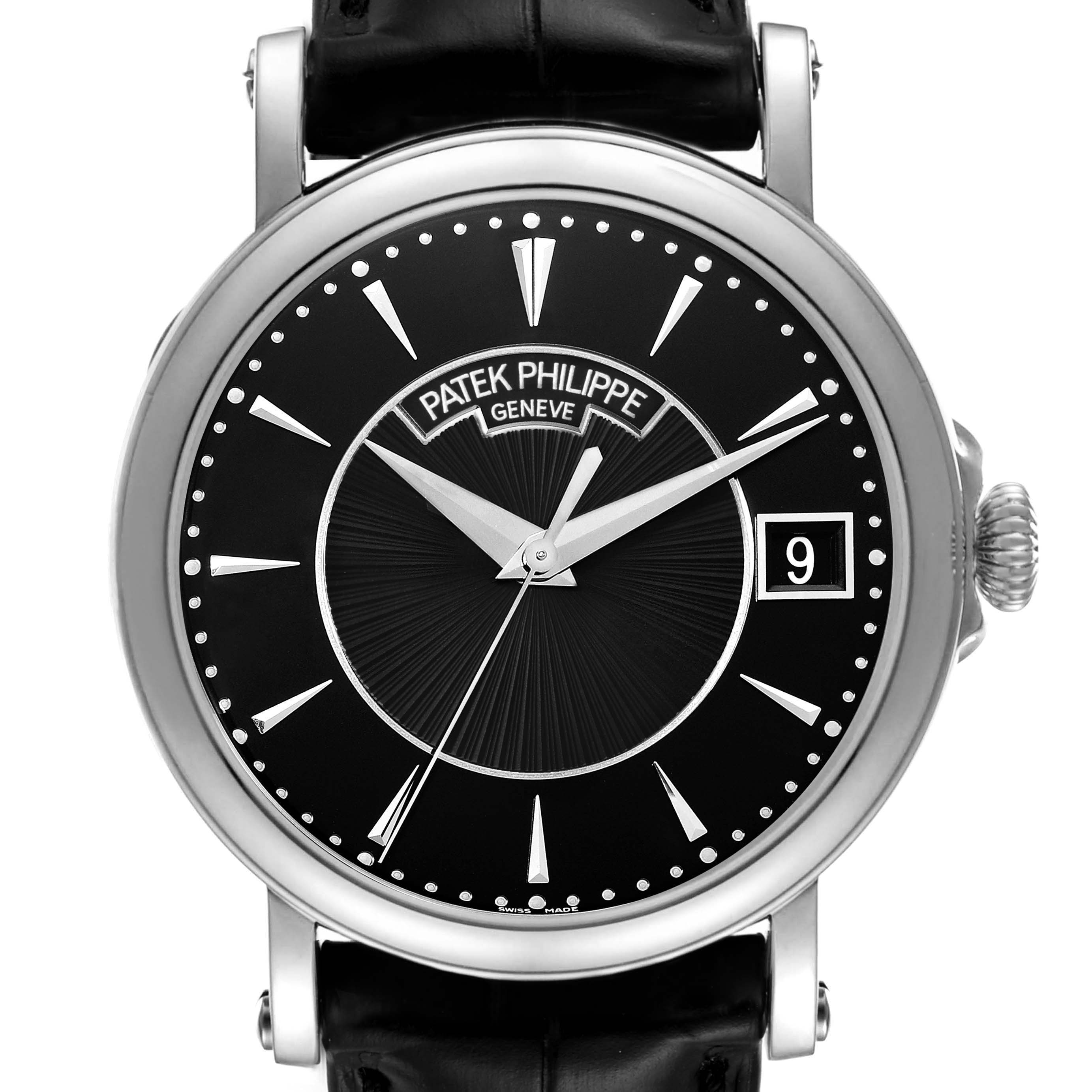 The Patek Philippe Calatrava 5153G Men's White Gold Black Dial watch is shown in a frontal view highlighting the dial, hour markers, hands, and crown.