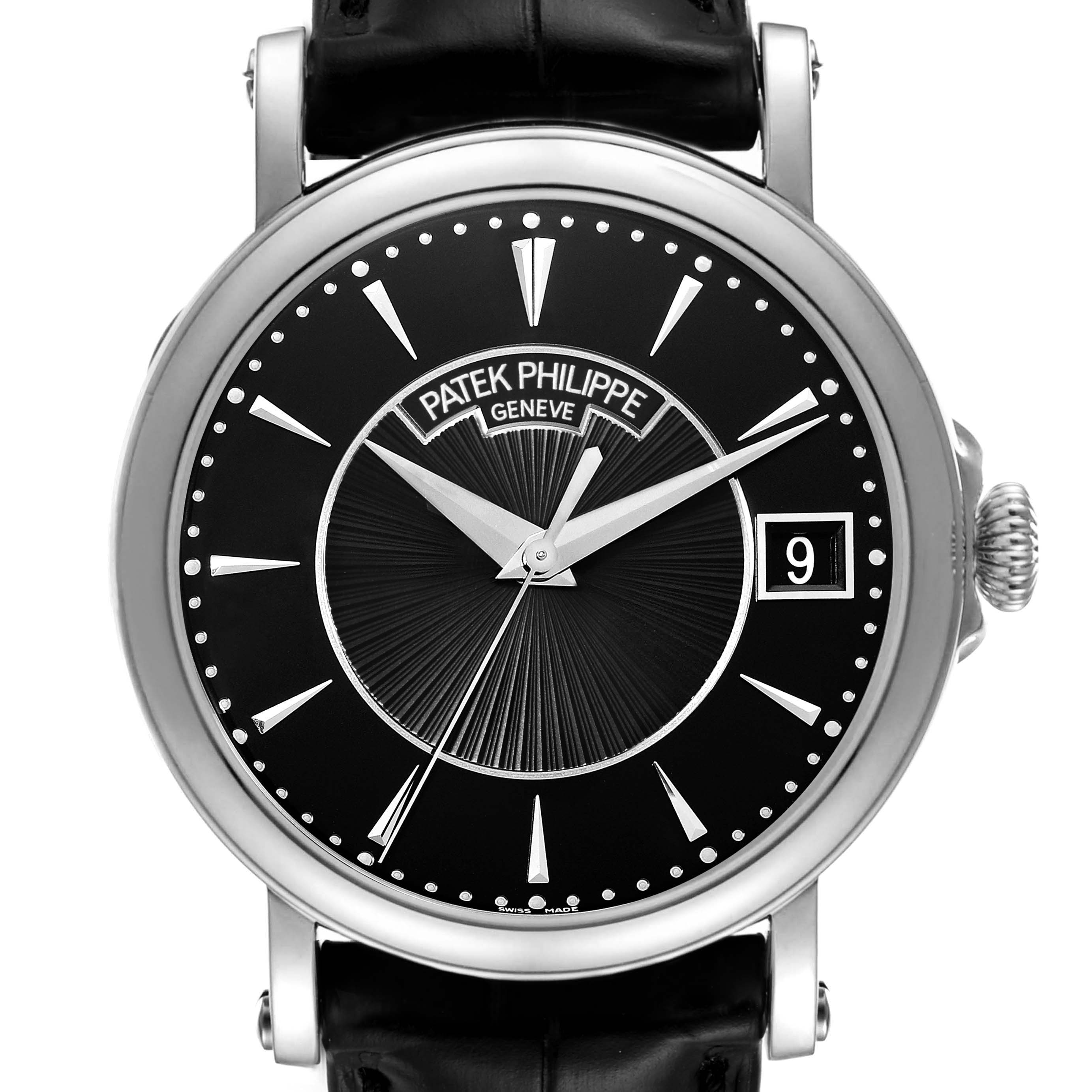 The Patek Philippe Calatrava 5153G Men's White Gold Black Dial 5153G Men's White Gold Black Dial watch is shown from the front, highlighting the black dial, silver hands, index markers, and crown.