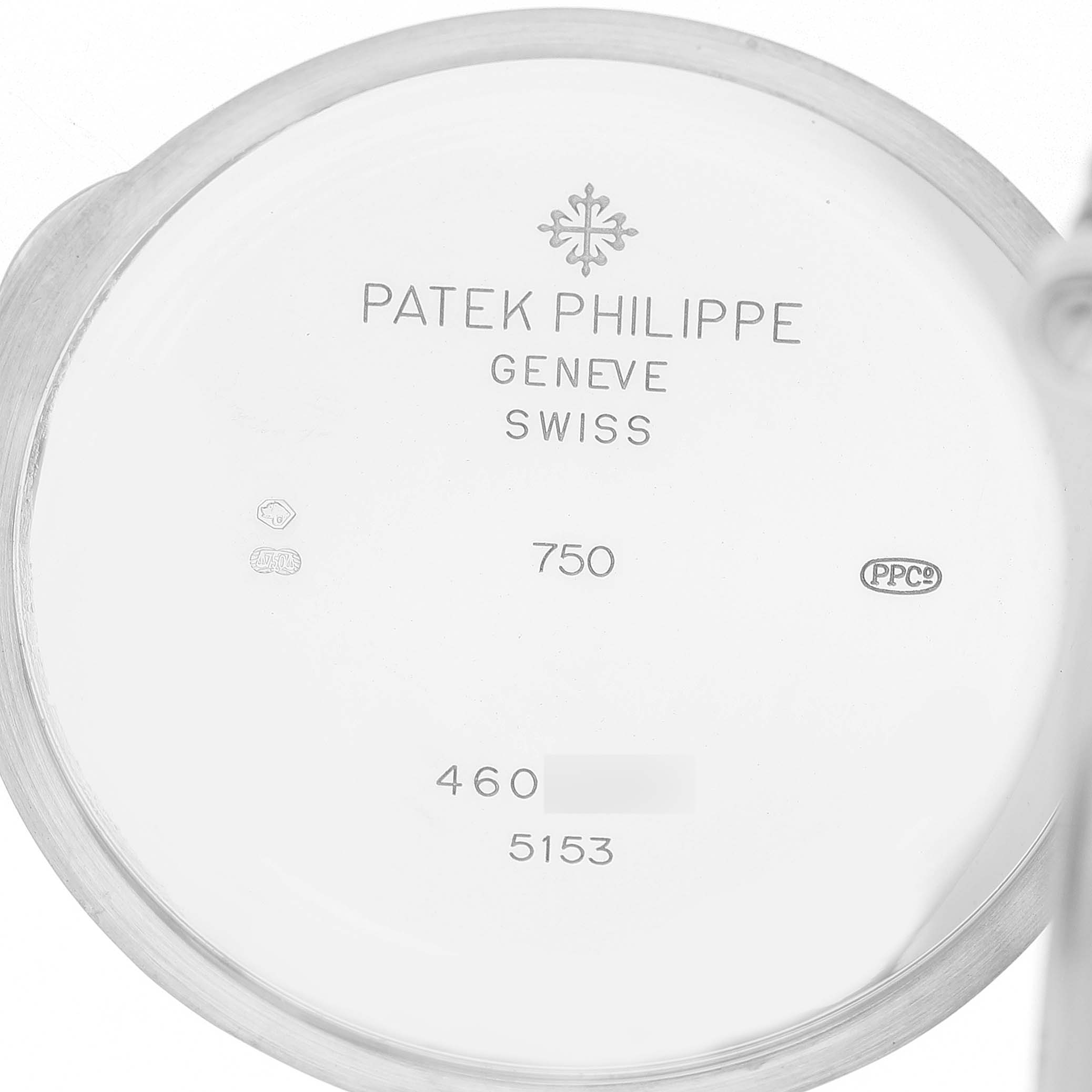 The image shows the inside case back of a Patek Philippe Calatrava 5153G-001 Men's White Gold Black Dial watch with inscriptions and hallmarks visible.