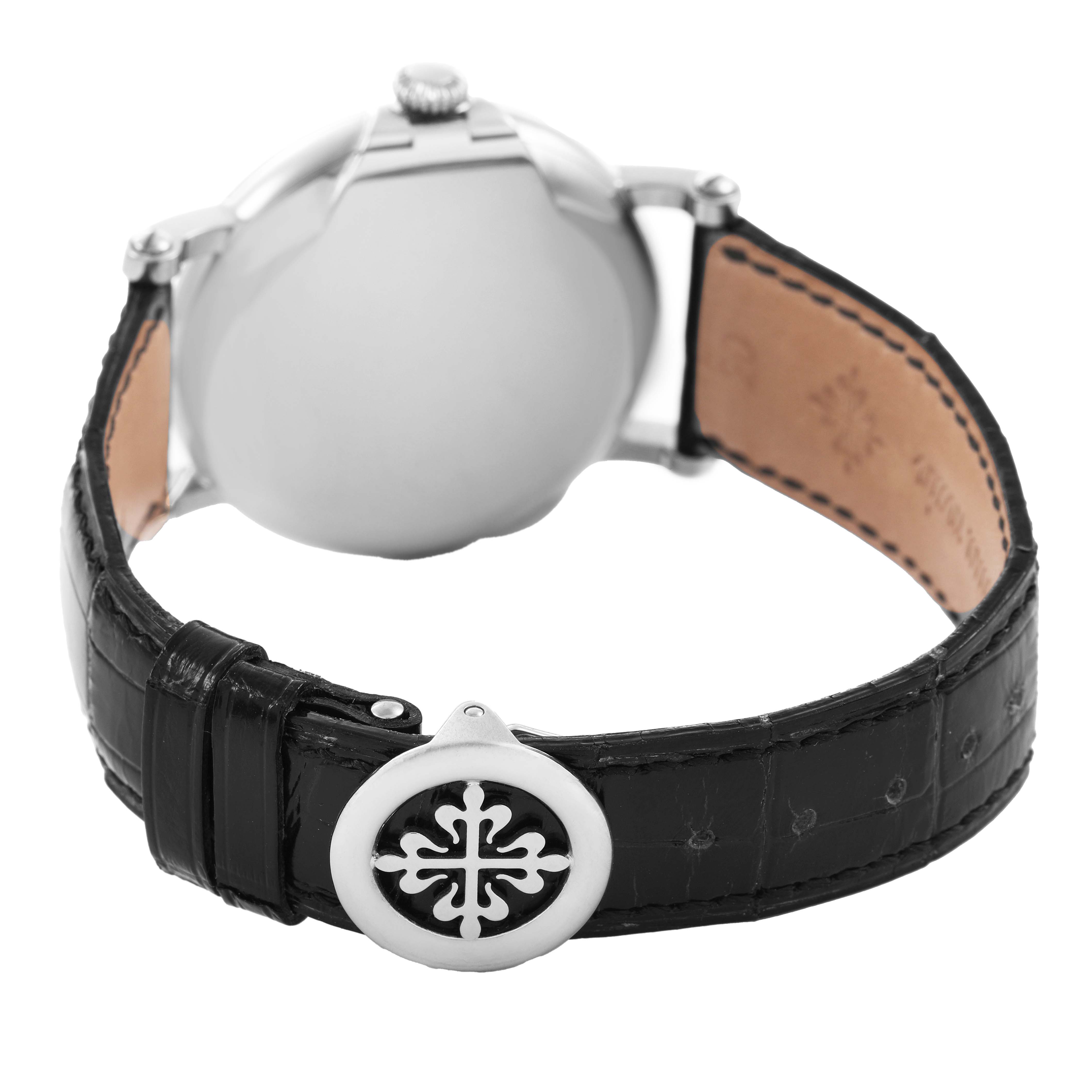 The image shows the back of the Patek Philippe Calatrava 5153G-001 Men's White Gold Black Dial watch, focusing on the strap with a distinct clasp design.