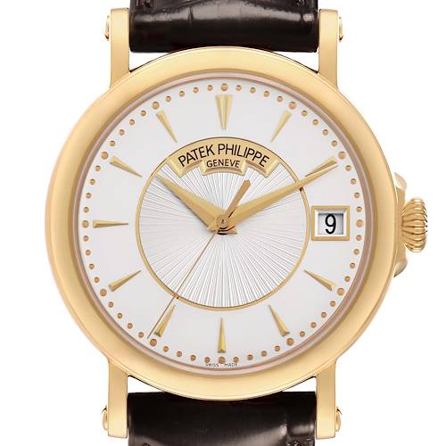 The image shows a frontal view of the Patek Philippe Calatrava 5153J Men's Yellow Gold Silver Dial watch, highlighting the dial, hands, date window, and leather strap.