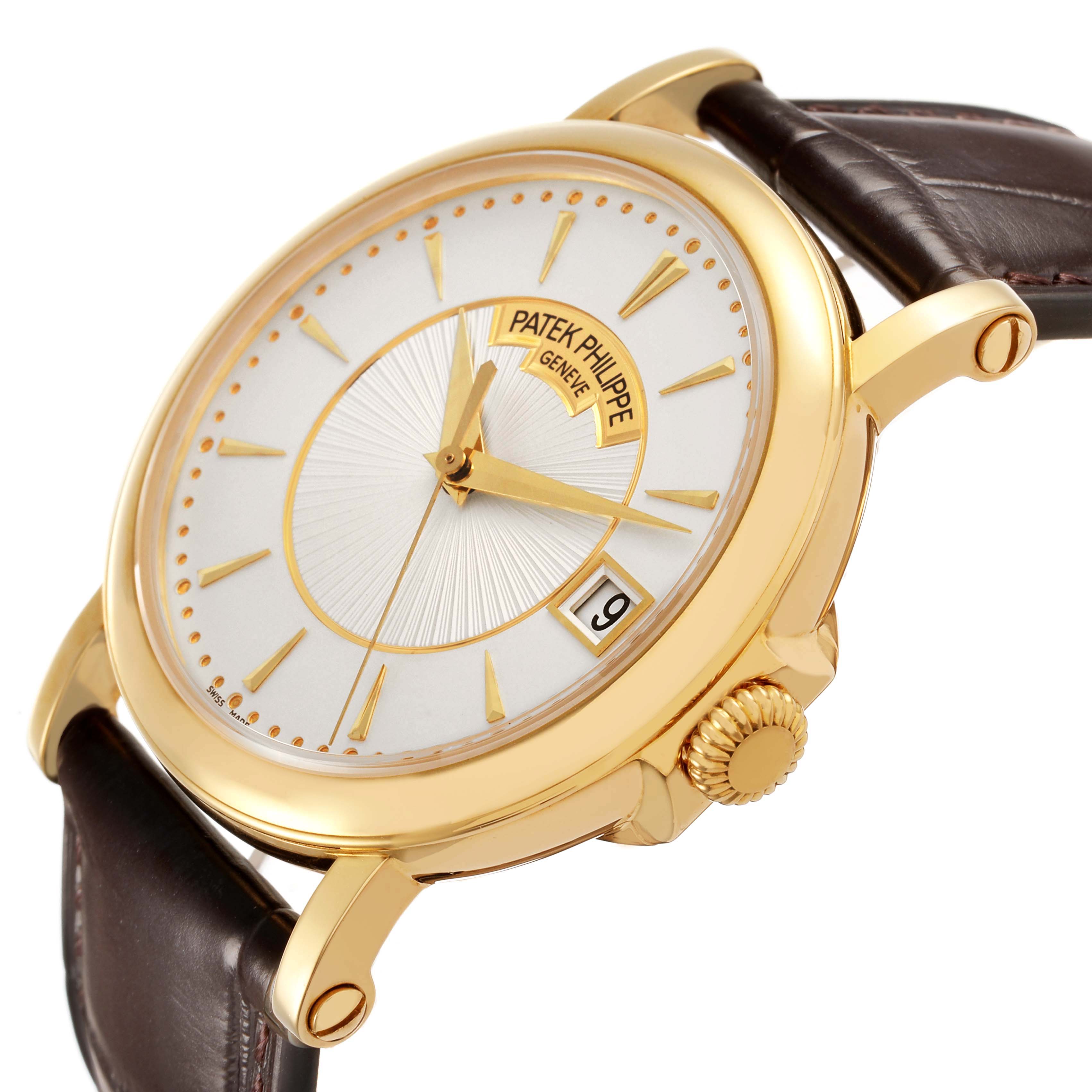 The Patek Philippe Calatrava 5153J Men's Yellow Gold Silver Dial watch is shown from a three-quarter angle, highlighting the gold case, crown, and brown leather strap.