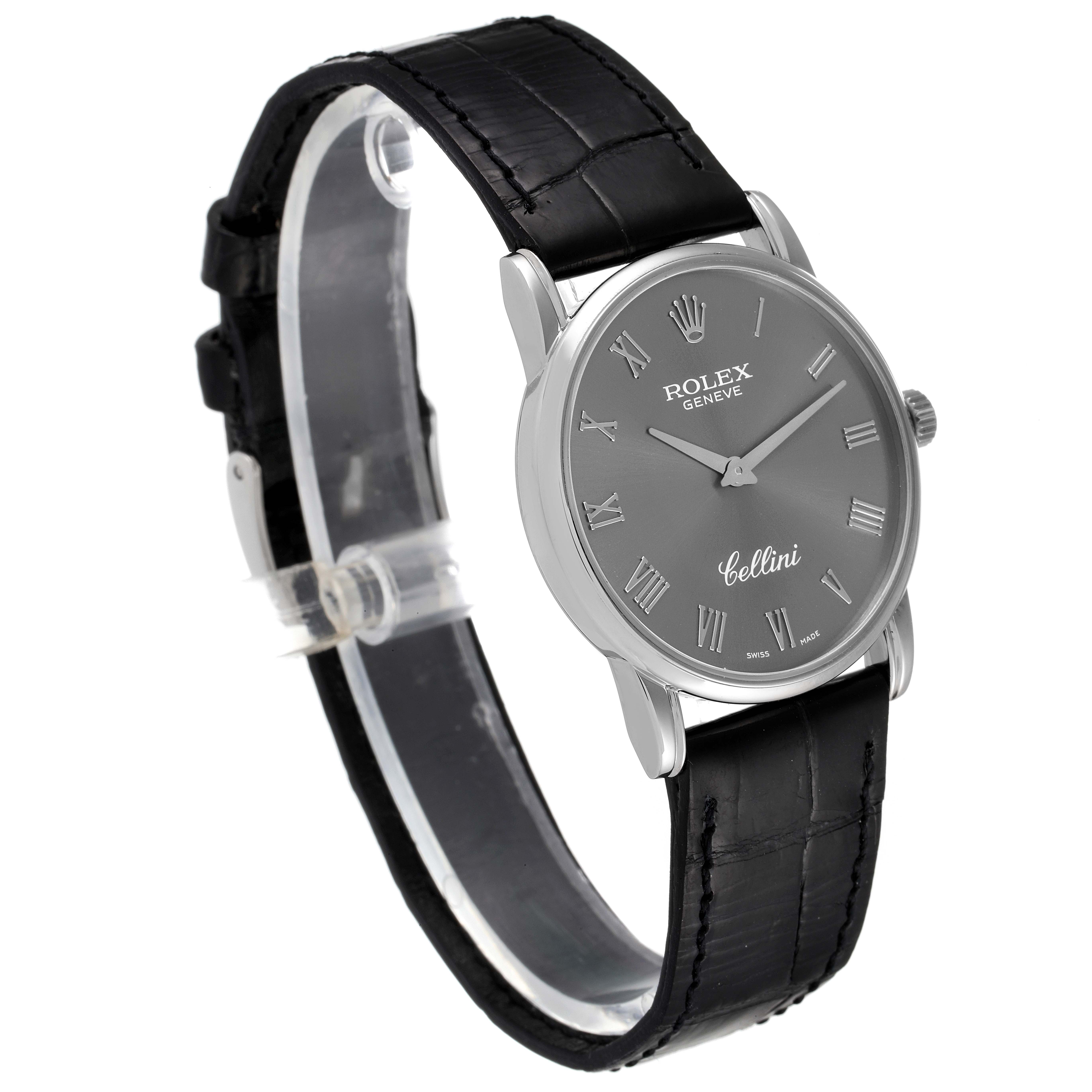 This image showcases a Rolex Cellini 5116 Men's White Gold Grey Dial 5116 Men's White Gold Grey Dial watch, angled to highlight its black leather strap, silver roman numeral dial, and stainless steel case.