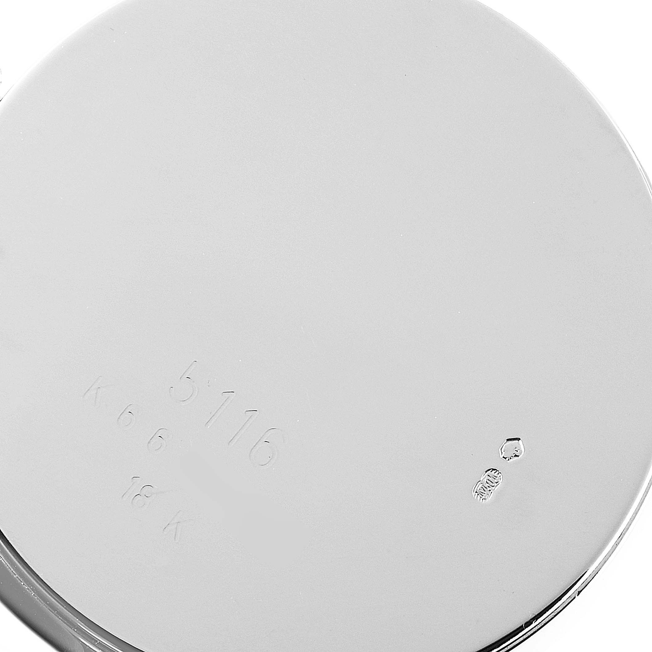 This image shows the back case of a Rolex Cellini 5116 Men's White Gold Grey Dial 5116 Men's White Gold Grey Dial model watch, displaying its engraved serial numbers.