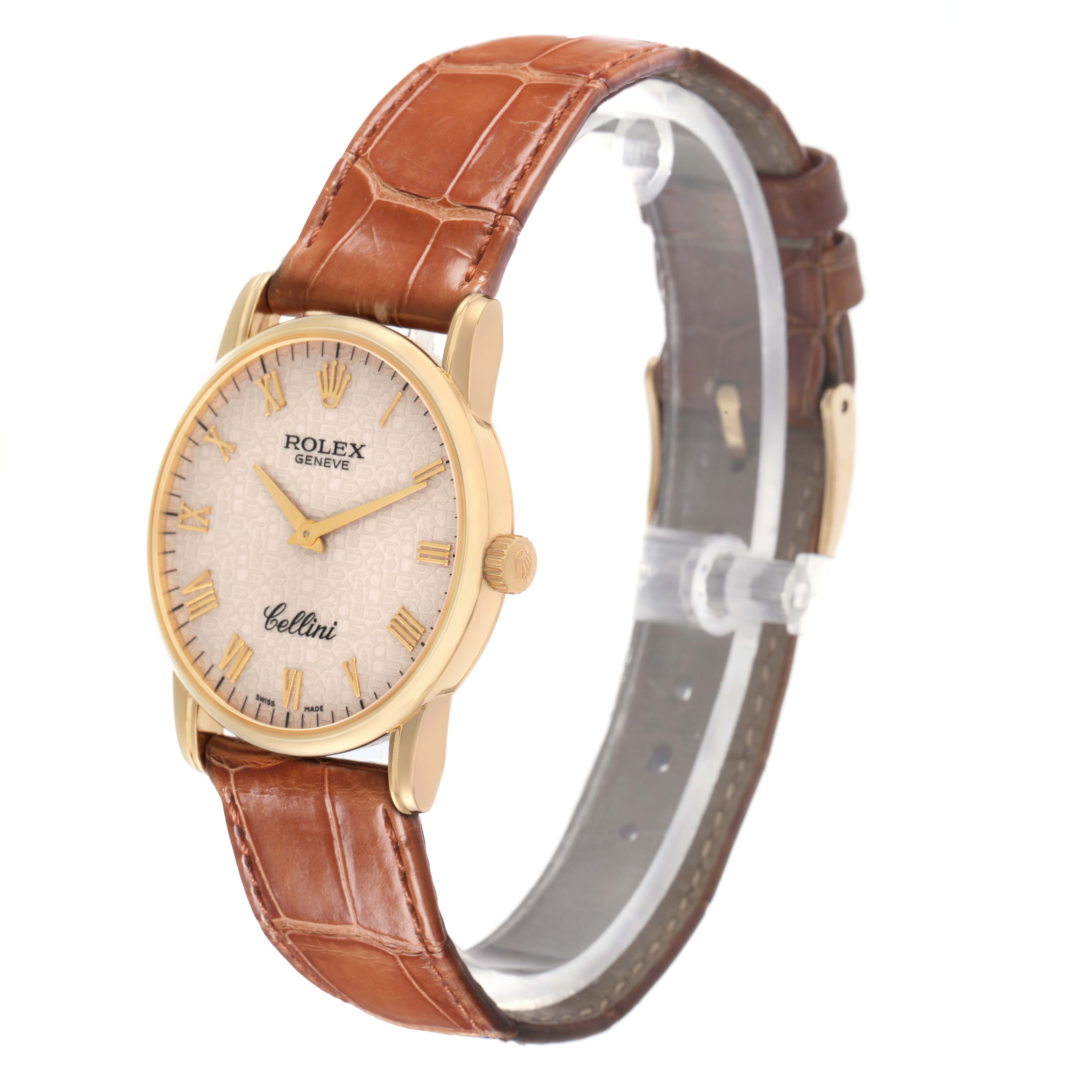 The Rolex Cellini 5116 Men
s Yellow Gold Beige Dial watch is shown at an angled side view, highlighting the face, case, and leather strap.