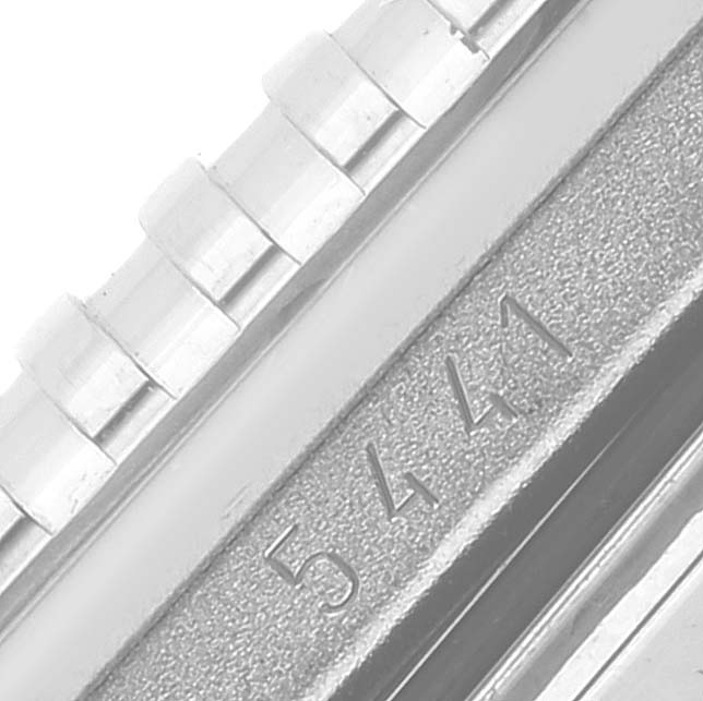 This is a close-up of the serial number on the side of the Rolex Cellini 5441 Men's White Gold Silver Dial 5441 Men's White Gold Silver Dial watch case.