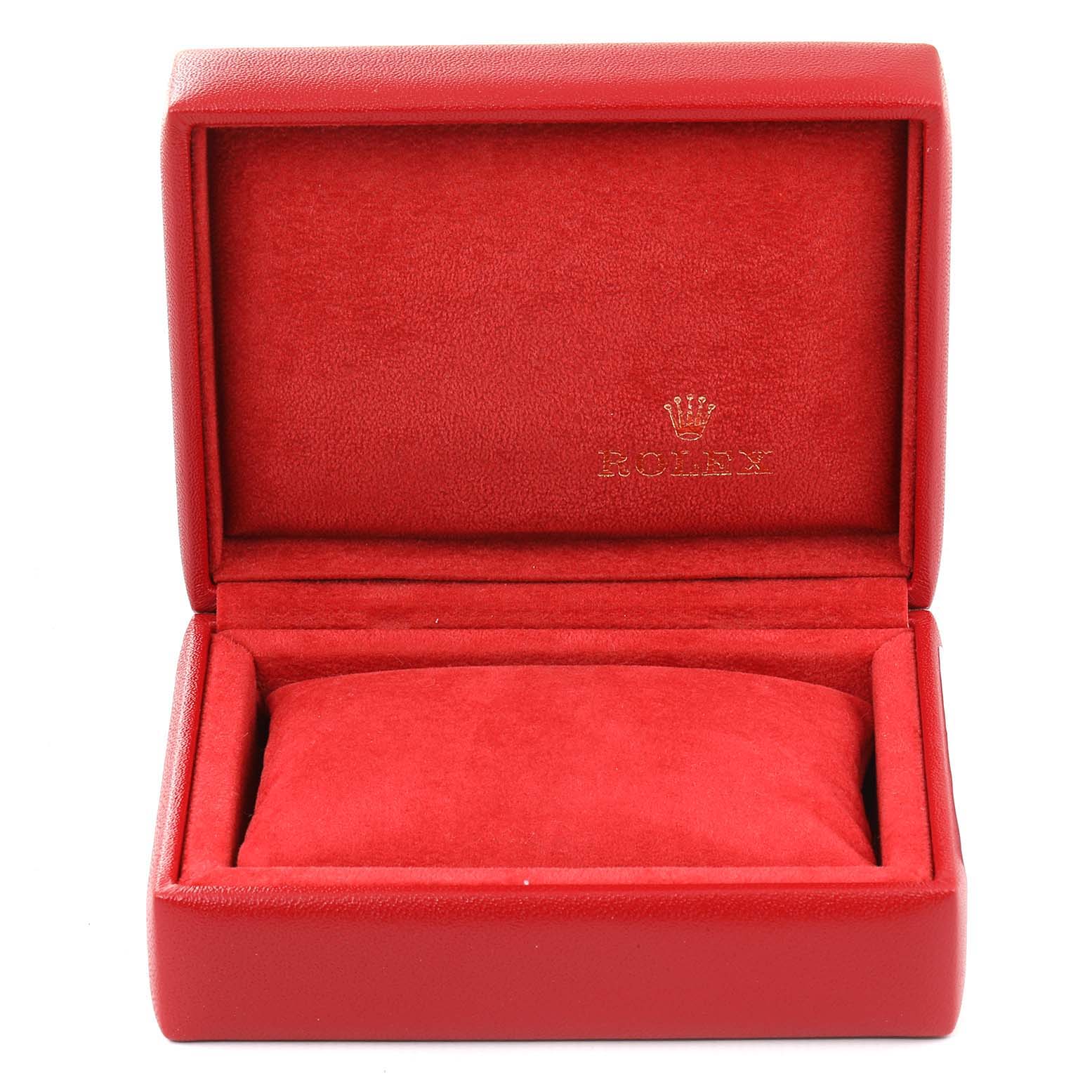 The image shows an open red Rolex watch box for the Date model, displaying its interior lining and cushion.