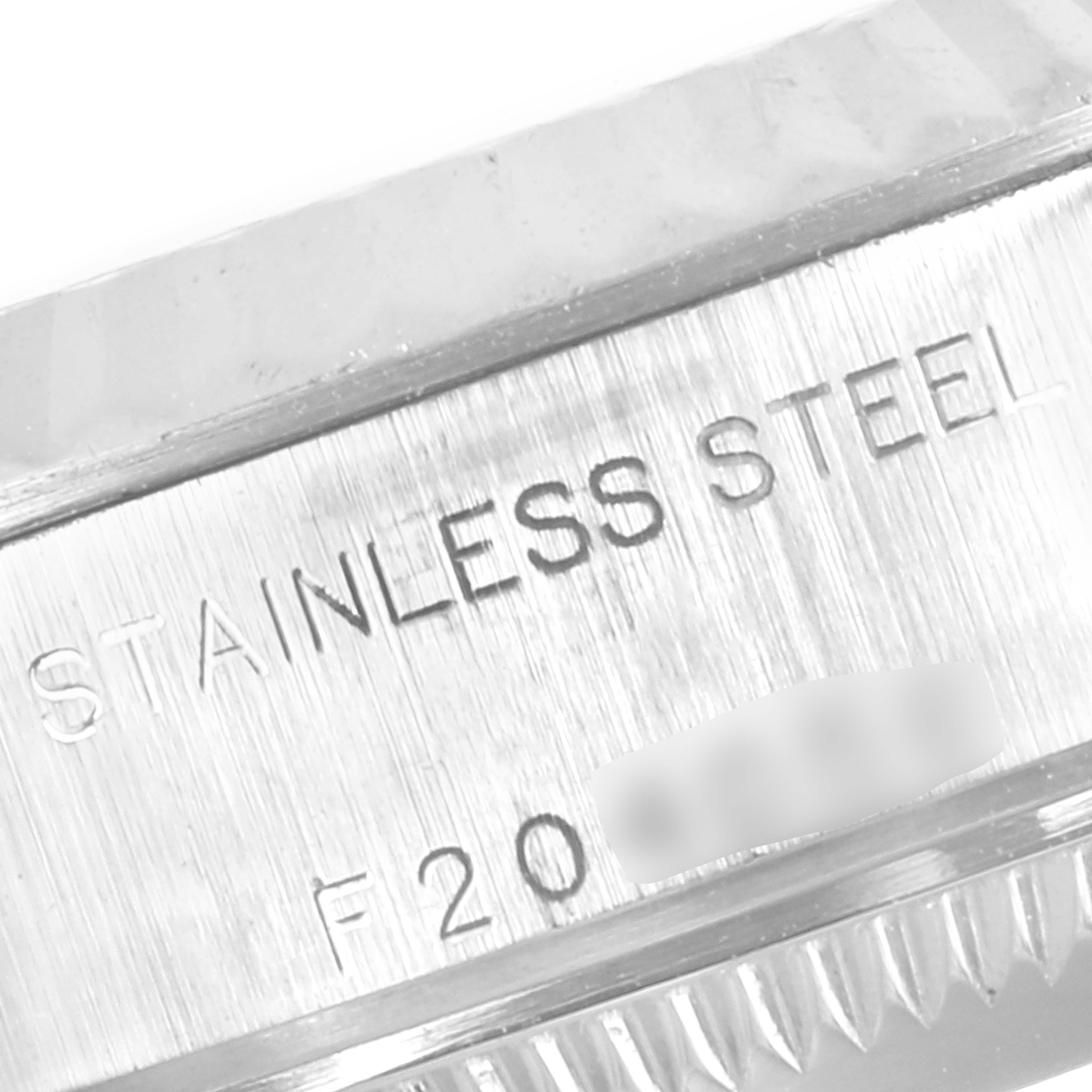 The image shows a close-up view of the case side of a Rolex Datejust 79174 Women
s Stainless Steel Silver Dial 79174 Women
s Stainless Steel Silver Dial model, highlighting the "STAINLESS STEEL" engraving.