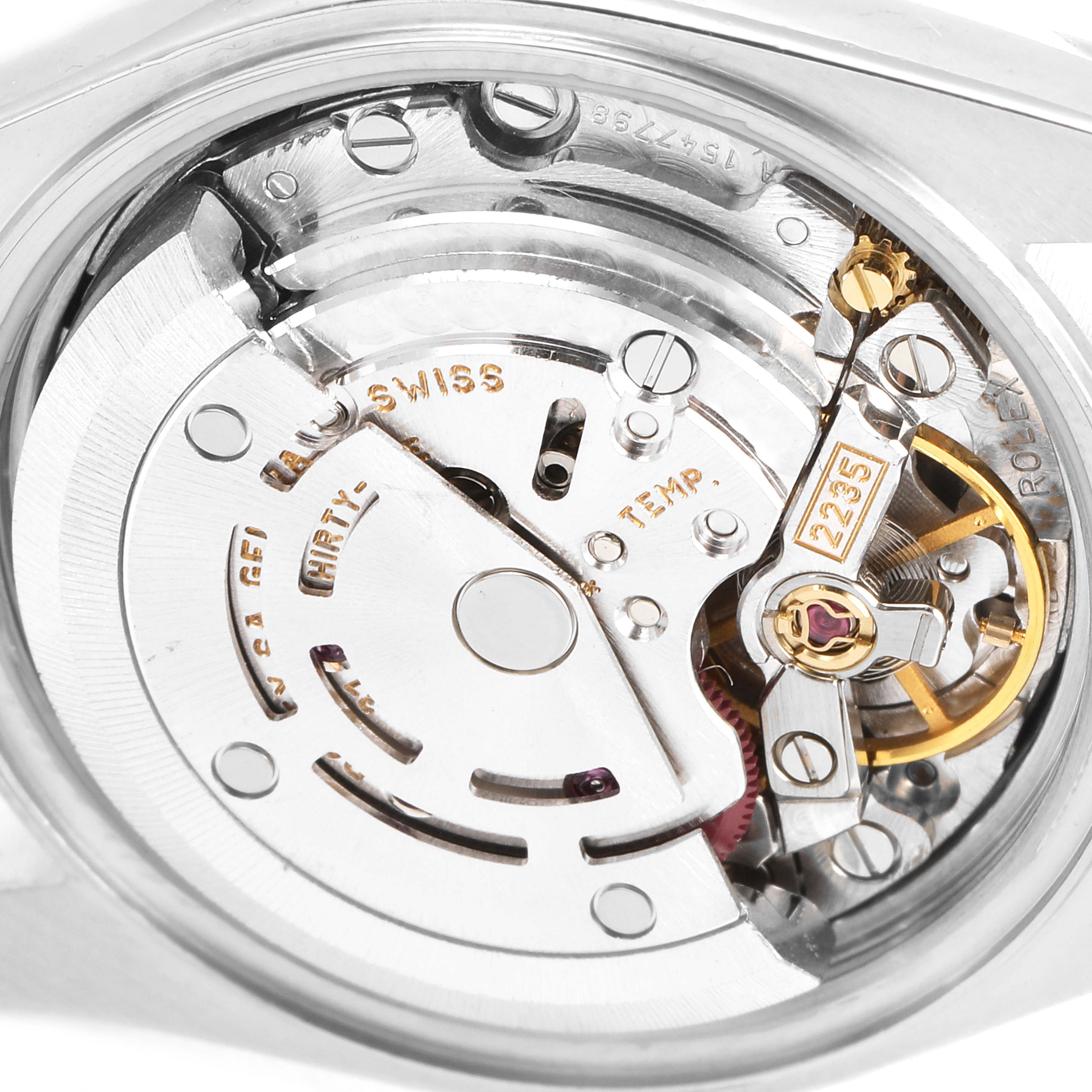 This image shows an internal view of the Rolex Datejust 79174 Women
s Stainless Steel Silver Dial 79174 Women
s Stainless Steel Silver Dial watch, highlighting its intricate movement and components.